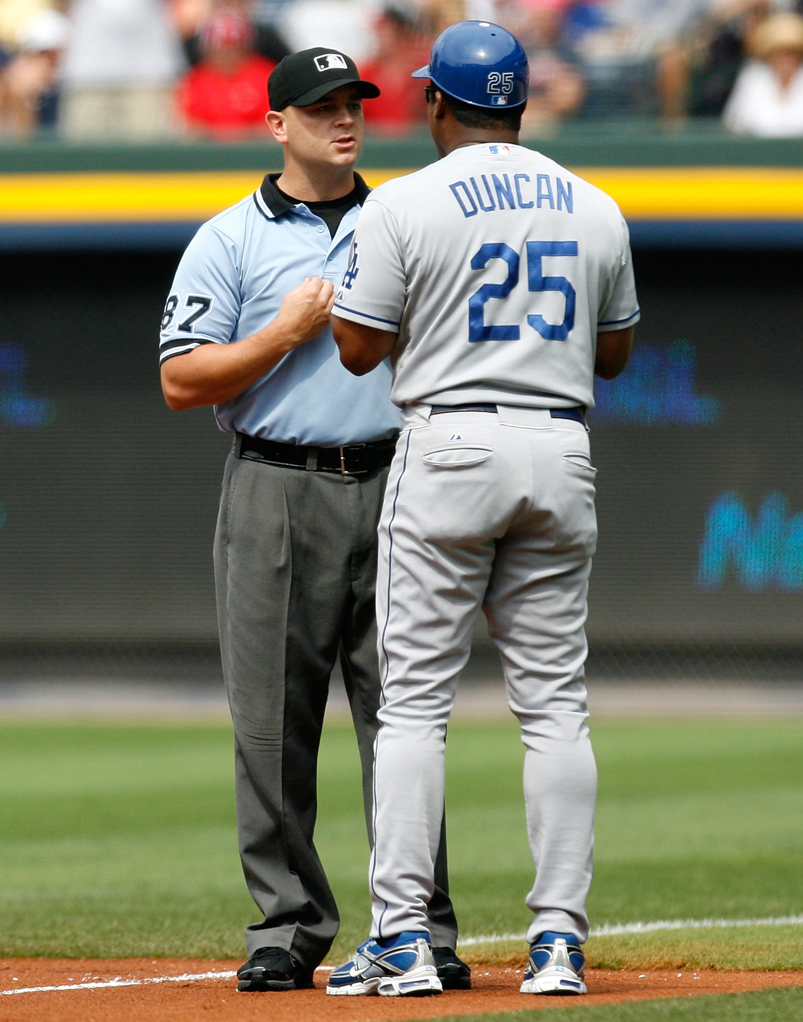 ATLANTA - AUGUST 01:  First base coach Mariano Duncan #25 of the Los Angeles Dodgers argues a call with umpire Scott Barry against the Atlanta Braves on August 1, 2009 at Turner Field in Atlanta, Georgia.  (Photo by Kevin C. Cox/Getty Images)