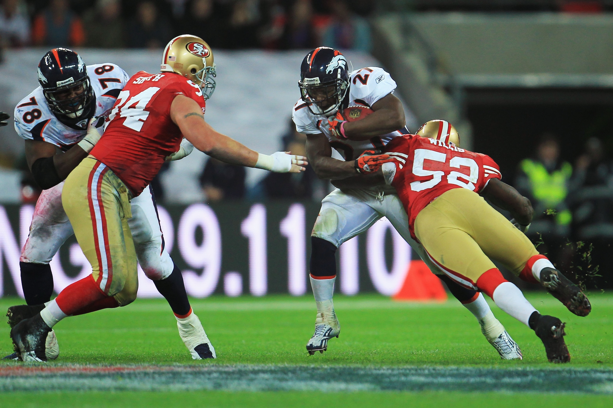 LONDON, ENGLAND - OCTOBER 31:  CJ Spillman #27 of Denver Broncos is tackled Patrick Willis #52 of San Francisco 49ers during the NFL International Series match between Denver Broncos and San Francisco 49ers at Wembley Stadium on October 31, 2010 in London