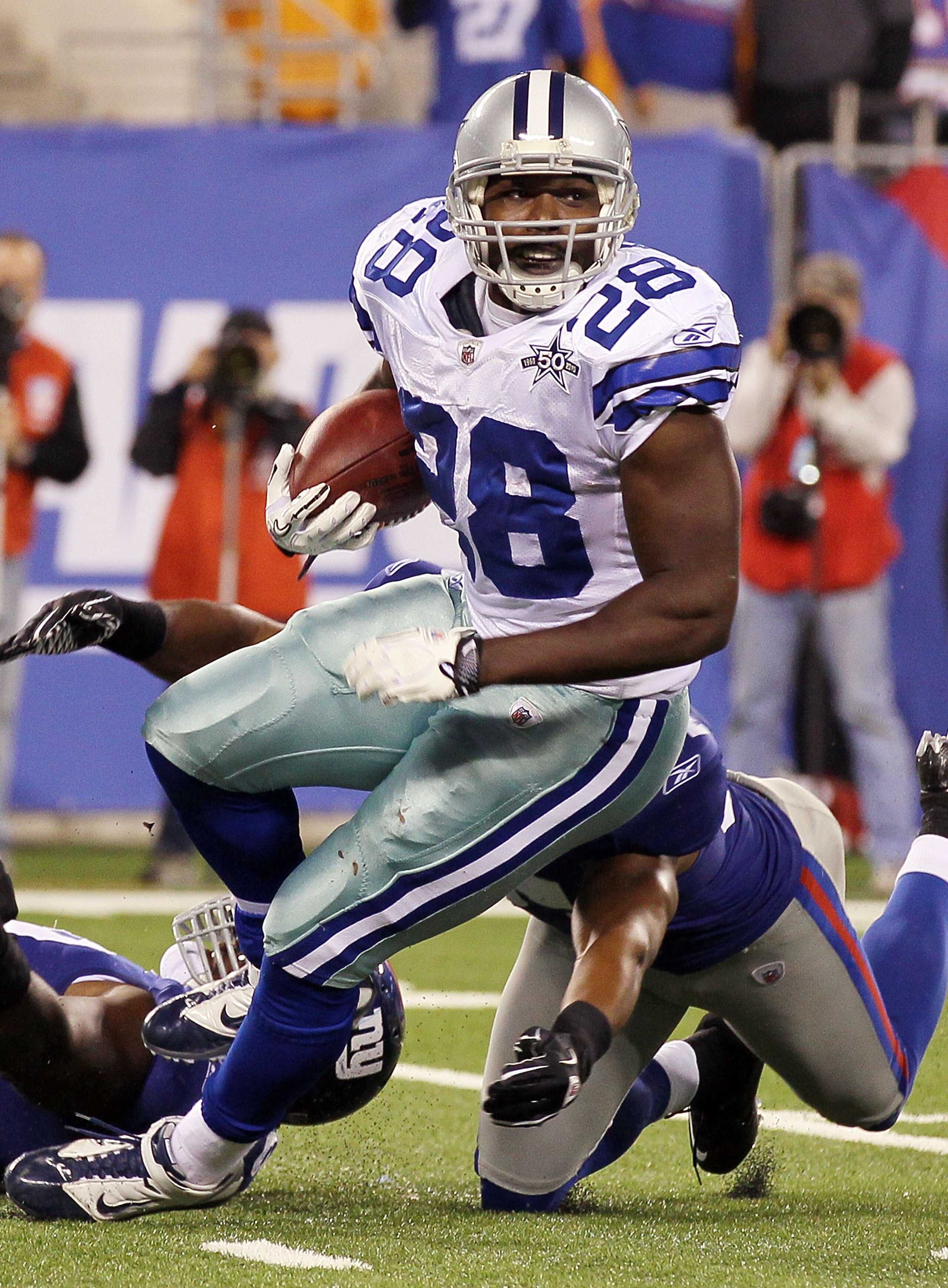 EAST RUTHERFORD, NJ - NOVEMBER 14: Felix Jones #28 of the Dallas Cowboys runs the ball against the New York Giants on November 14, 2010 at the New Meadowlands Stadium in East Rutherford, New Jersey. The Cowboys defeated the Giants 33-20.  (Photo by Jim Mc