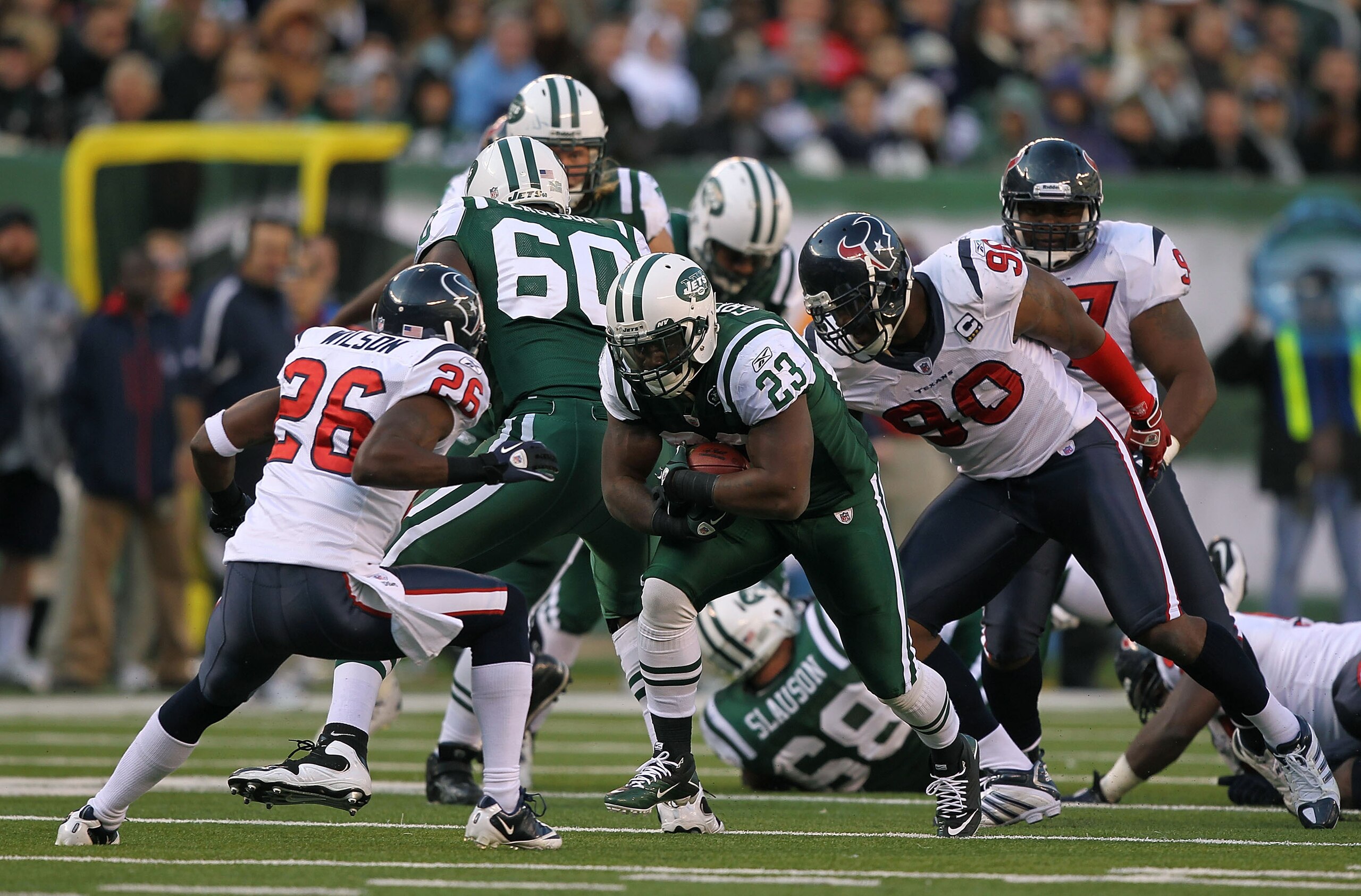 EAST RUTHERFORD, NJ - NOVEMBER 21:  Shonn Greene #23 of the New York Jets runs against Eugene Wilson #26 of the Houston Texans on November 21, 2010 at the New Meadowlands Stadium in East Rutherford, New Jersey.  (Photo by Al Bello/Getty Images)