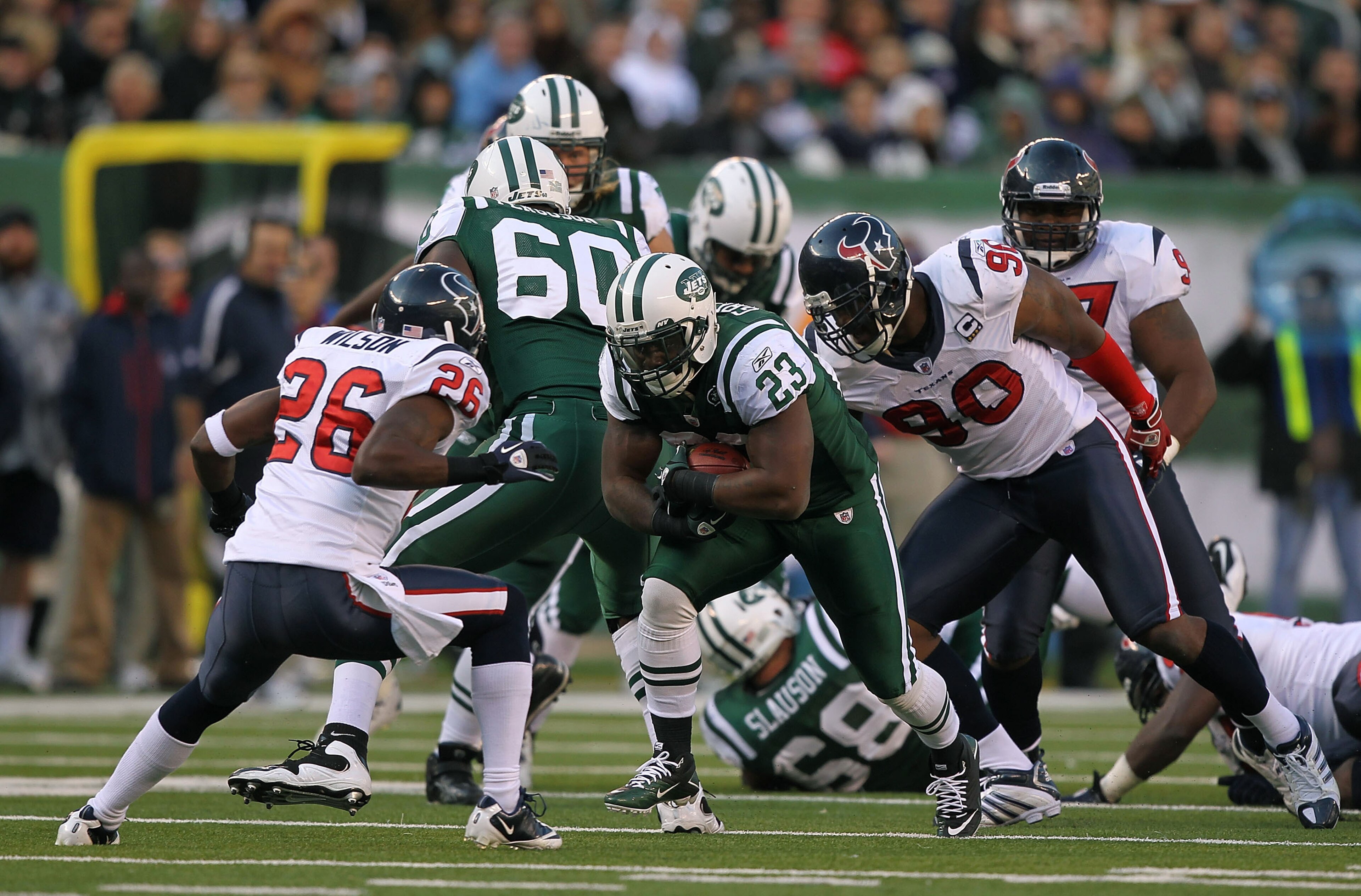 EAST RUTHERFORD, NJ - NOVEMBER 21:  Shonn Greene #23 of the New York Jets runs against Eugene Wilson #26 of the Houston Texans on November 21, 2010 at the New Meadowlands Stadium in East Rutherford, New Jersey.  (Photo by Al Bello/Getty Images)