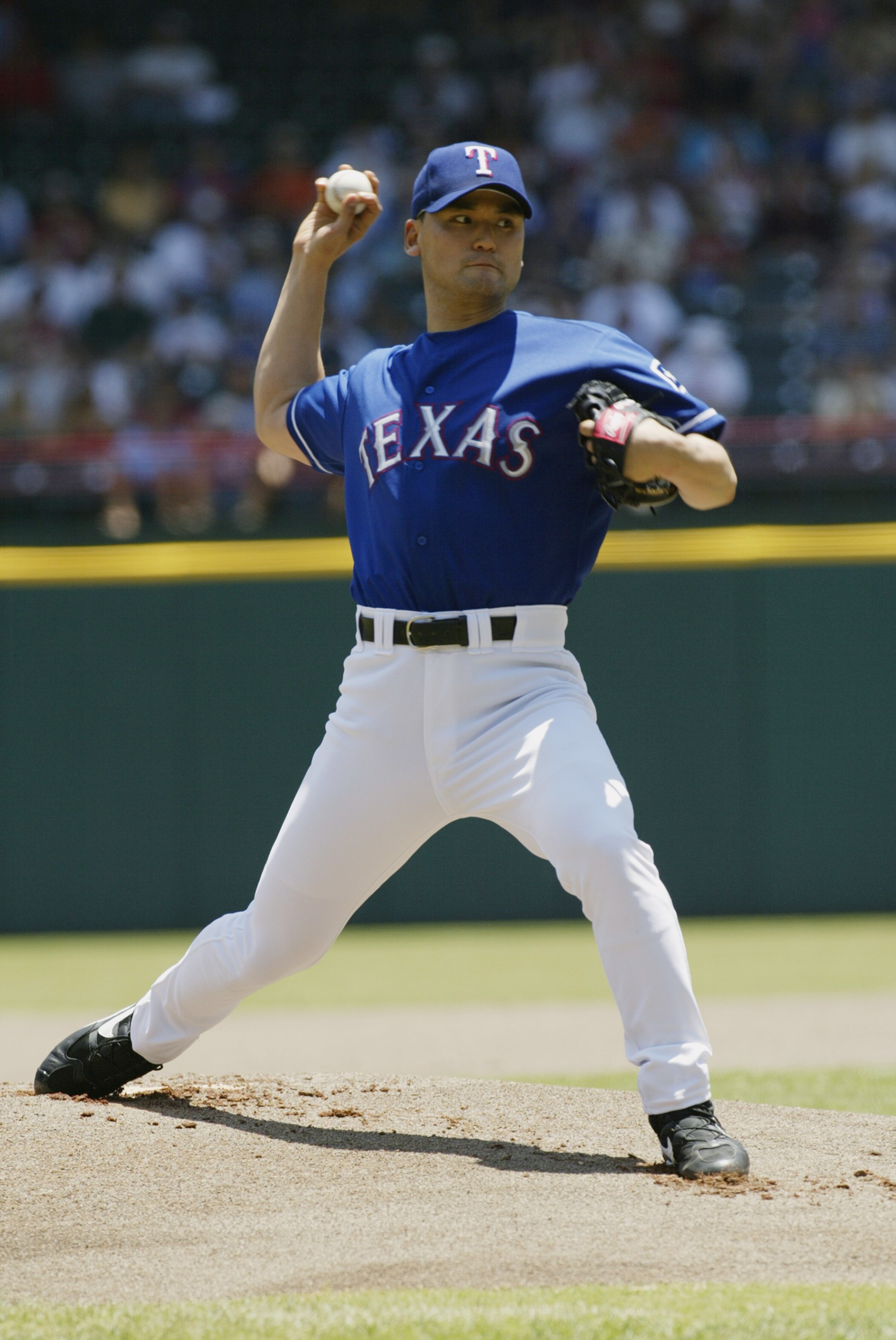 ARLINGTON-JUNE 2:  Chan Ho Park #61 of the Texas Rangers pitches the ball during the game against the Kansas City Royals  at The Ballpark in Arlington, Texas on June 2, 2002. The Rangers won 8-6. (Photo by Ronald Martinez/Getty Images)