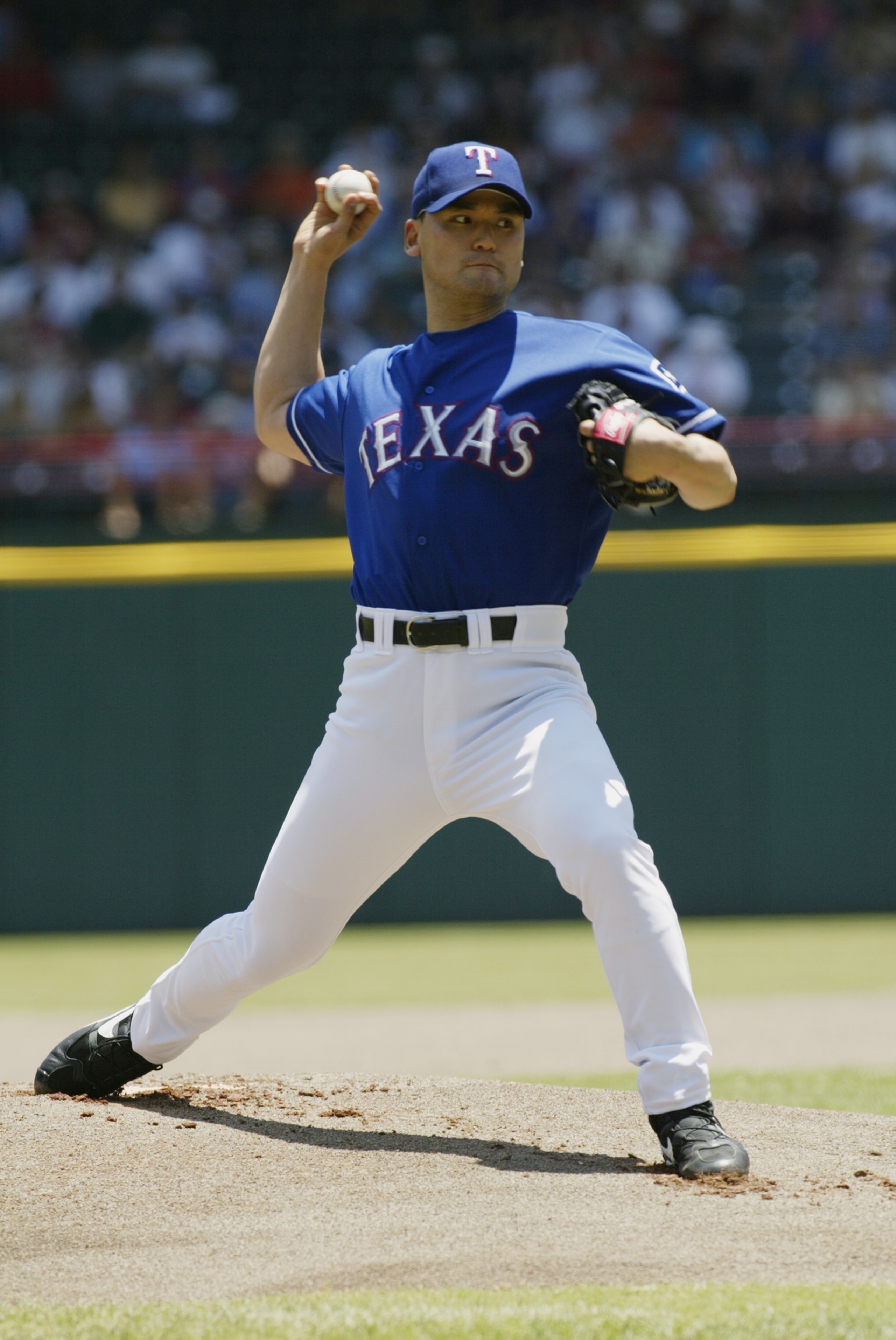 ARLINGTON-JUNE 2:  Chan Ho Park #61 of the Texas Rangers pitches the ball during the game against the Kansas City Royals  at The Ballpark in Arlington, Texas on June 2, 2002. The Rangers won 8-6. (Photo by Ronald Martinez/Getty Images)