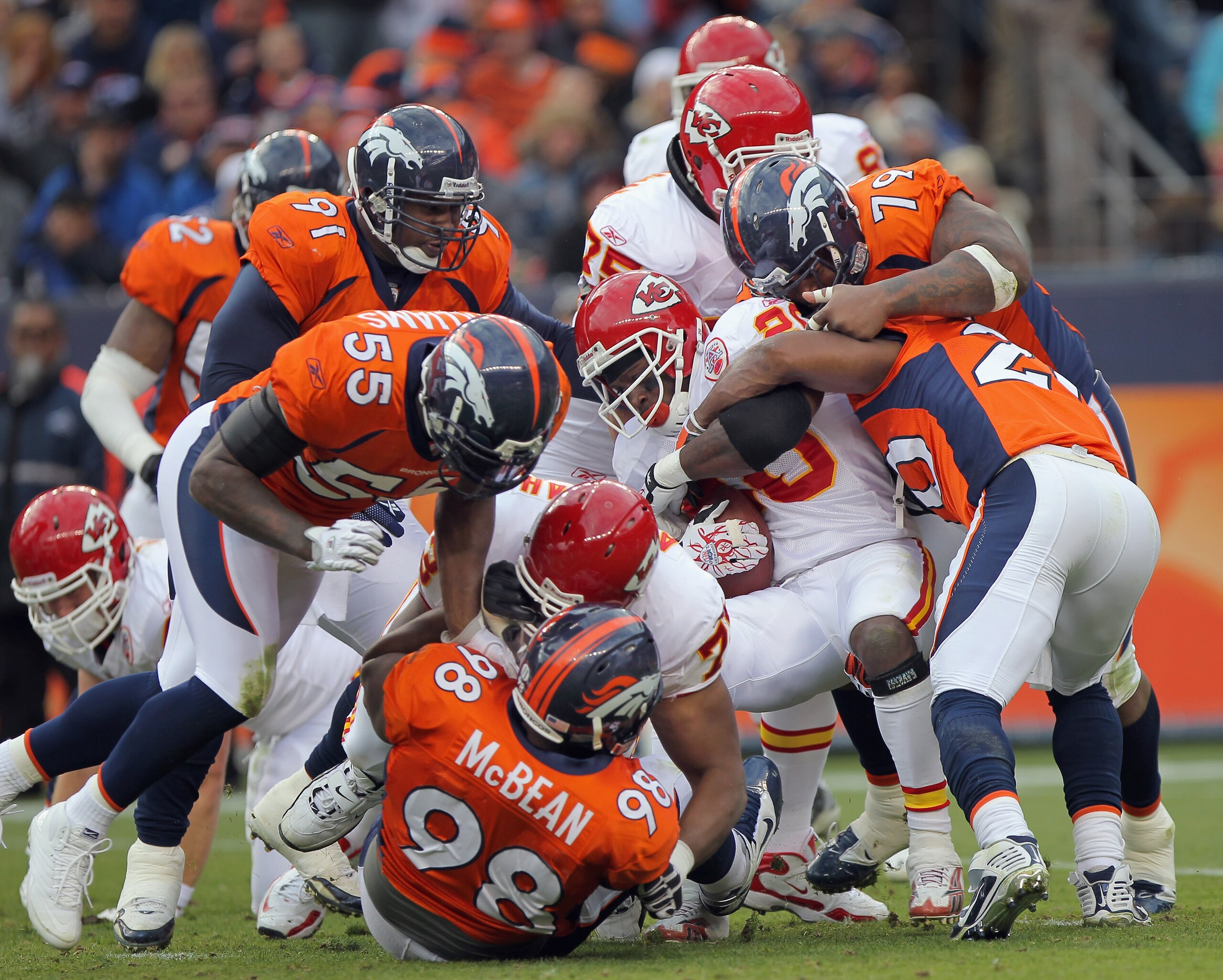 DENVER - NOVEMBER 14:  Running back Thomas Jones #20 of the Kansas City Chiefs is stopped by the Denver Bronco defense at INVESCO Field at Mile High on November 14, 2010 in Denver, Colorado.  (Photo by Doug Pensinger/Getty Images)