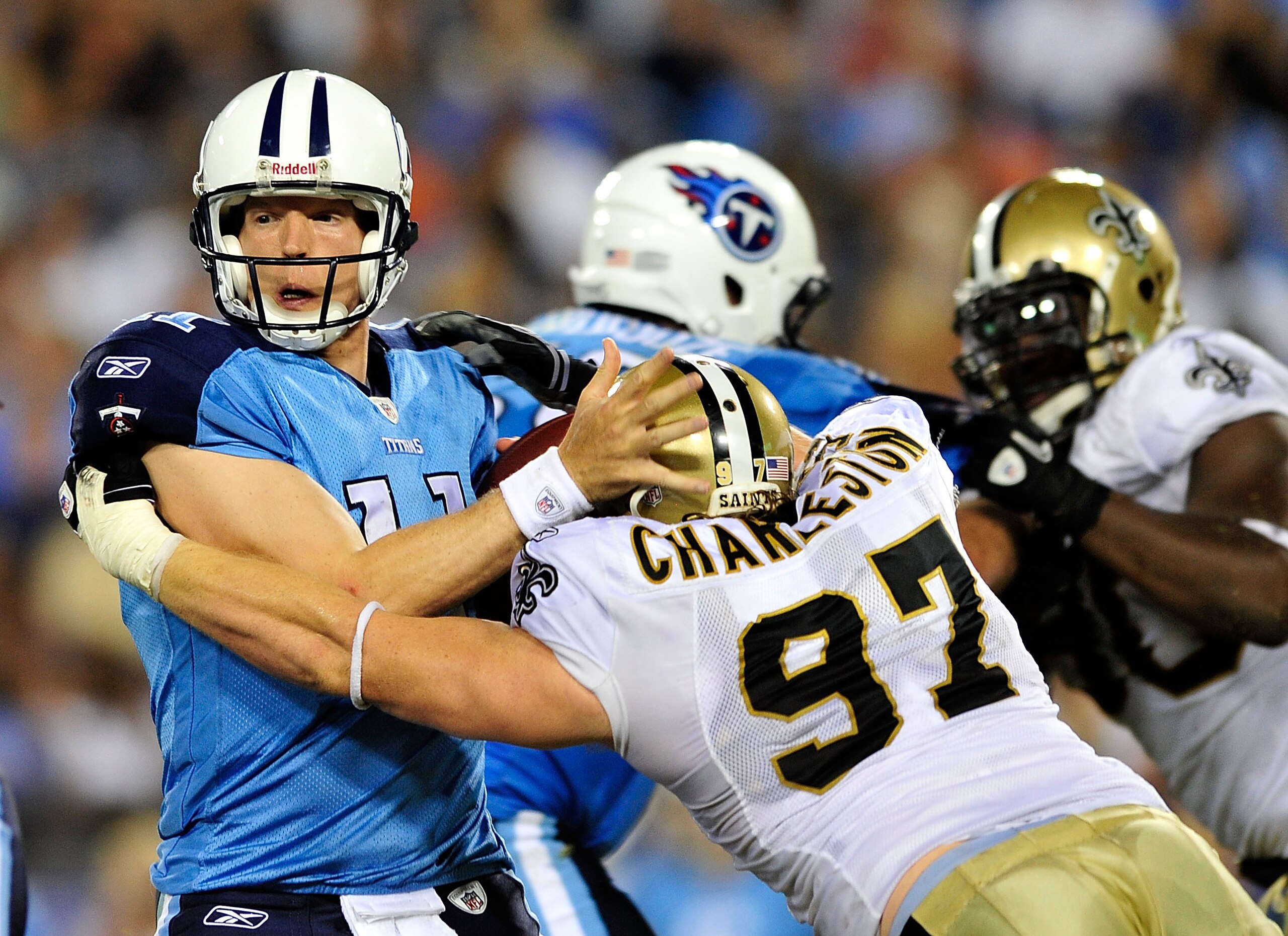 NASHVILLE, TN - SEPTEMBER 02: Jeff Charleston #97 of the New Orleans Saints sacks quarterback Chris Simms #11 of the Tennessee Titans during an exhibition game at LP Field on September 2, 2010 in Nashville, Tennessee. Tennessee won 27-24. (Photo by Gra NASHVILLE, TN - SEPTEMBER 02: Jeff Charleston #97 of the New Orleans Saints sacks quarterback Chris Simms #11 of the Tennessee Titans during an exhibition game at LP Field on September 2, 2010 in Nashville, Tennessee. Tennessee won 27-24. (Photo by Gra