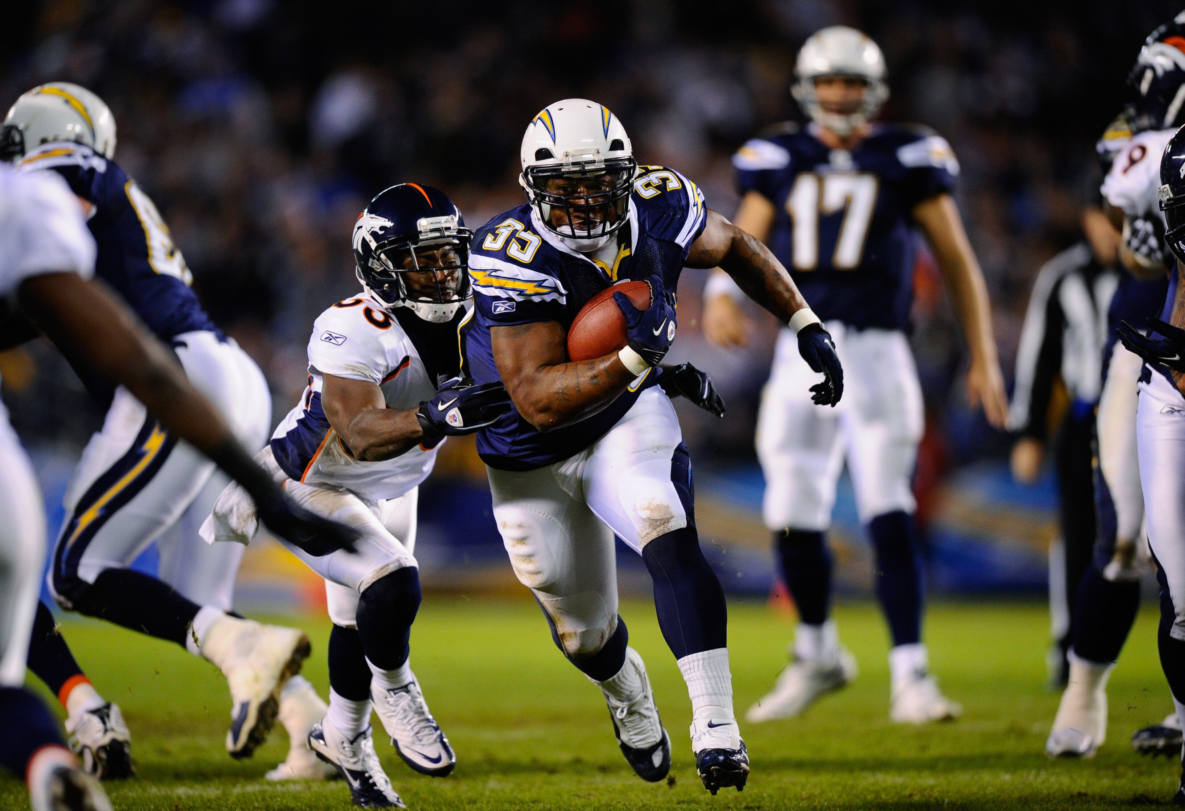 SAN DIEGO - NOVEMBER 22: Mike Tolbert #35 of the San Diego Chargers breaks a tackle against Nate Jones #33 of the Denver Broncos as he rushes for a gain at Qualcomm Stadium on November 22, 2010 in San Diego, California. (Photo by Kevork Djansezian/Getty SAN DIEGO - NOVEMBER 22: Mike Tolbert #35 of the San Diego Chargers breaks a tackle against Nate Jones #33 of the Denver Broncos as he rushes for a gain at Qualcomm Stadium on November 22, 2010 in San Diego, California. (Photo by Kevork Djansezian/Getty