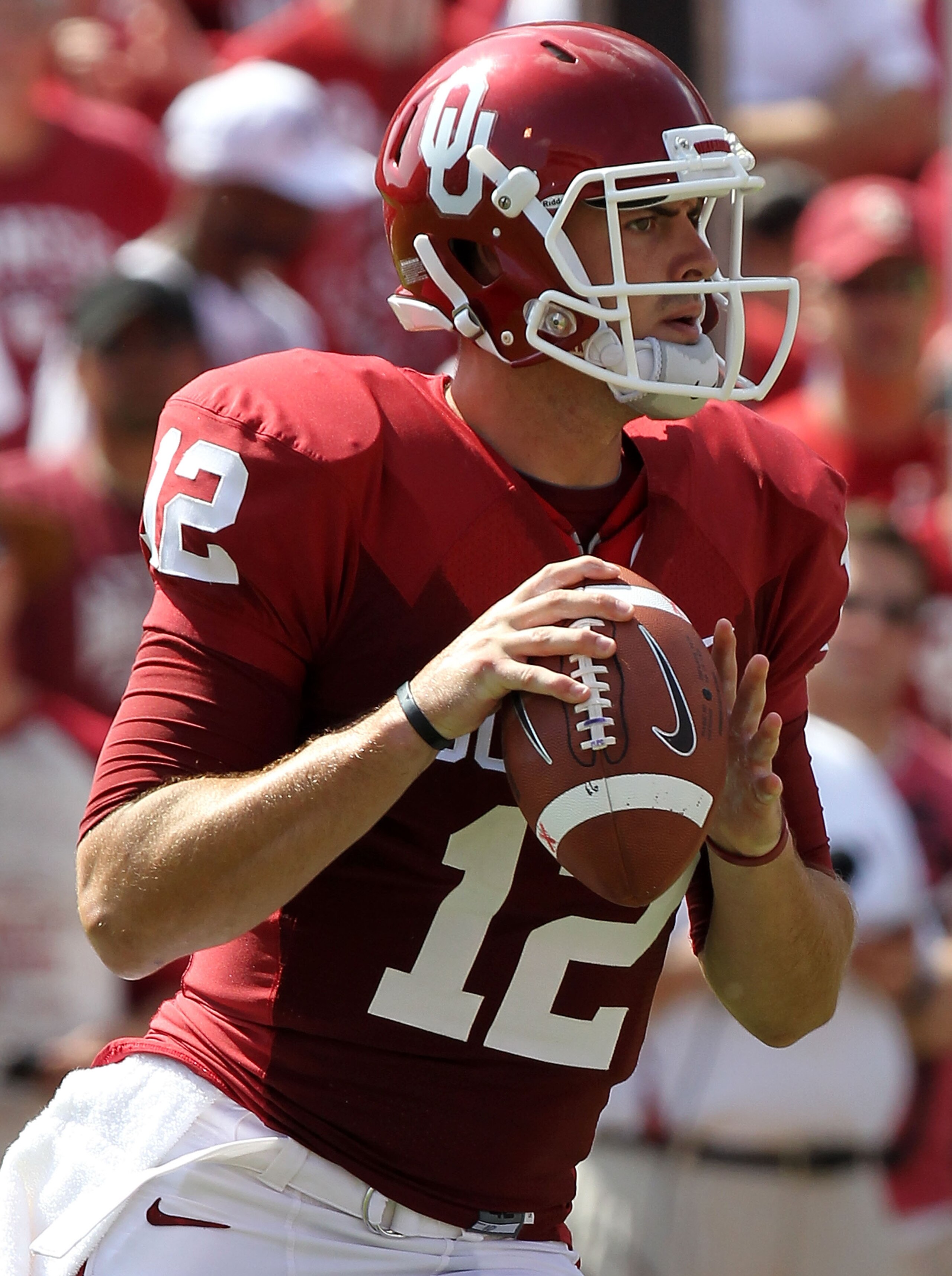 NORMAN, OK - SEPTEMBER 11:  Quarterback Landry Jones #12 of the Oklahoma Sooners drops back to pass against the Florida State Seminoles in the first quarter at Gaylord Family Oklahoma Memorial Stadium on September 11, 2010 in Norman, Oklahoma.  (Photo by