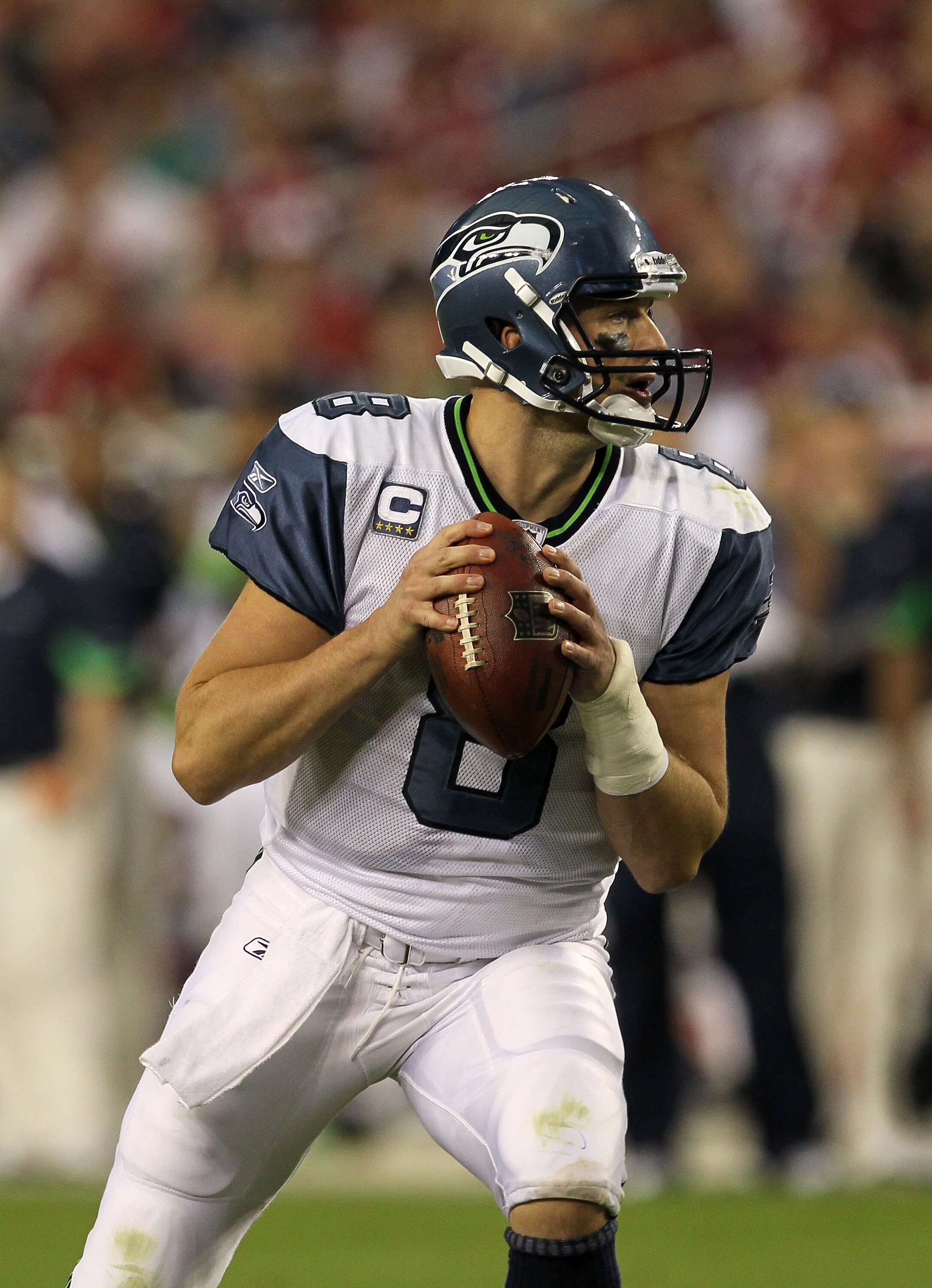 GLENDALE, AZ - NOVEMBER 14:  Quarterback Matt Hasselbeck #8 of the Seattle Seahawks drops back to pass with his left wrist wrapped after injuring it in the game with the Arizona Cardinals at University of Phoenix Stadium on November 14, 2010 in Glendale,