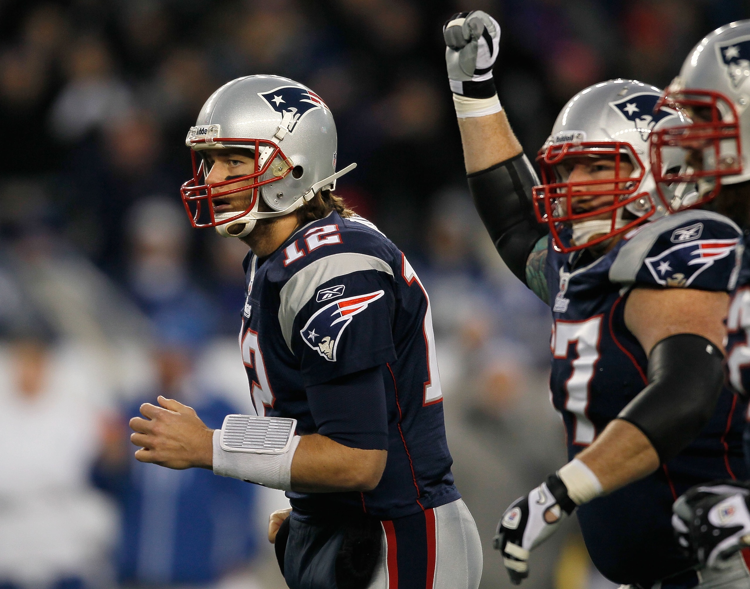 FOXBORO, MA - NOVEMBER 21: Tom Brady #12 of the New England Patriots reacts with teammate Dan Koppen #67 of the New England Patriots after a touchdown in the first half at Gillette Stadium on November 21, 2010 in Foxboro, Massachusetts. (Photo by Jim Roga FOXBORO, MA - NOVEMBER 21: Tom Brady #12 of the New England Patriots reacts with teammate Dan Koppen #67 of the New England Patriots after a touchdown in the first half at Gillette Stadium on November 21, 2010 in Foxboro, Massachusetts. (Photo by Jim Roga