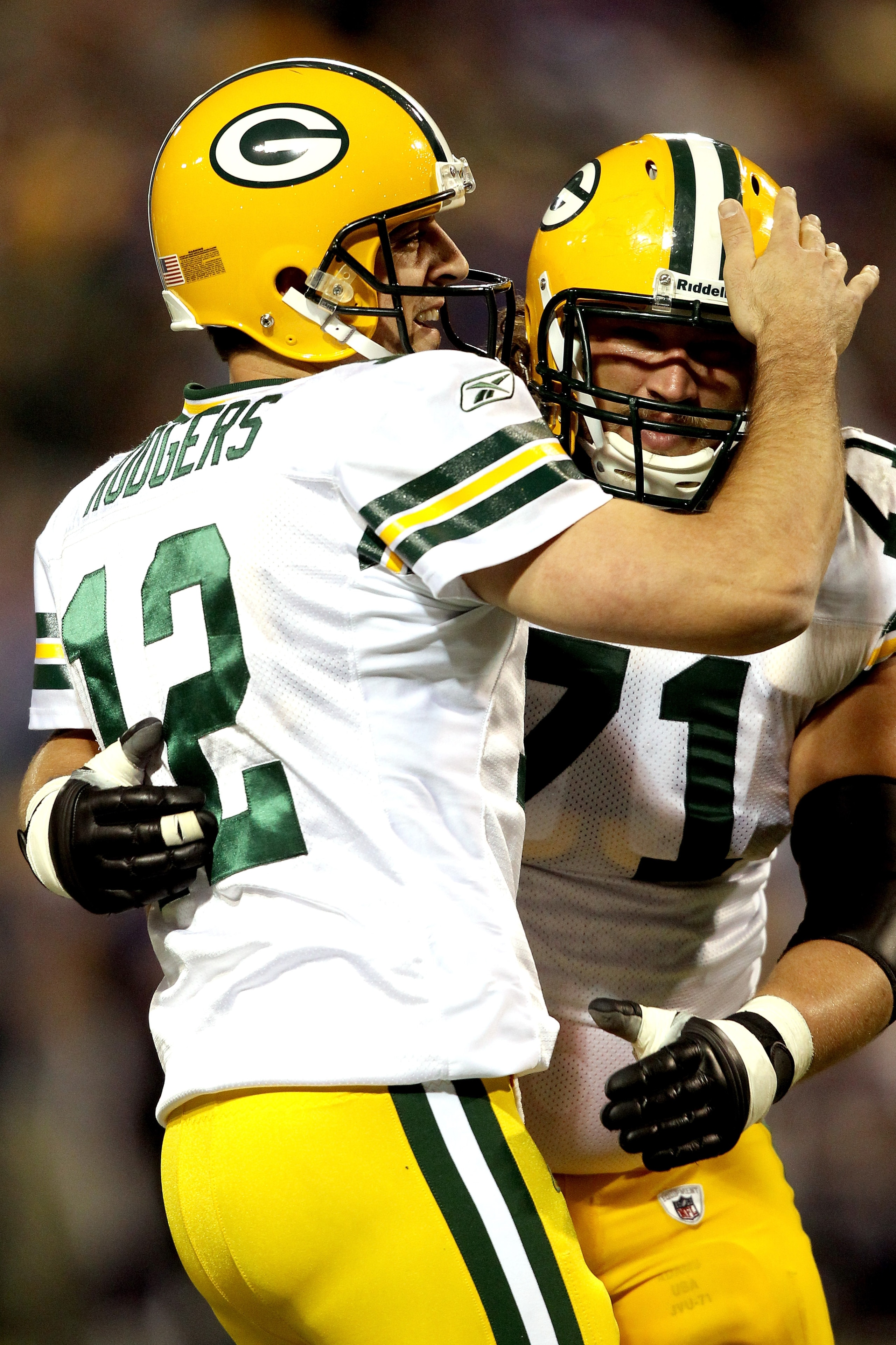 MINNEAPOLIS - NOVEMBER 21: Quarterback Aaron Rodgers #12 of the Green Bay Packers celebrates with Josh Sitton #71 after throwing a touchdown against the Minnesota Vikings at the Hubert H. Humphrey Metrodome on November 21, 2010 in Minneapolis, Minnesota.