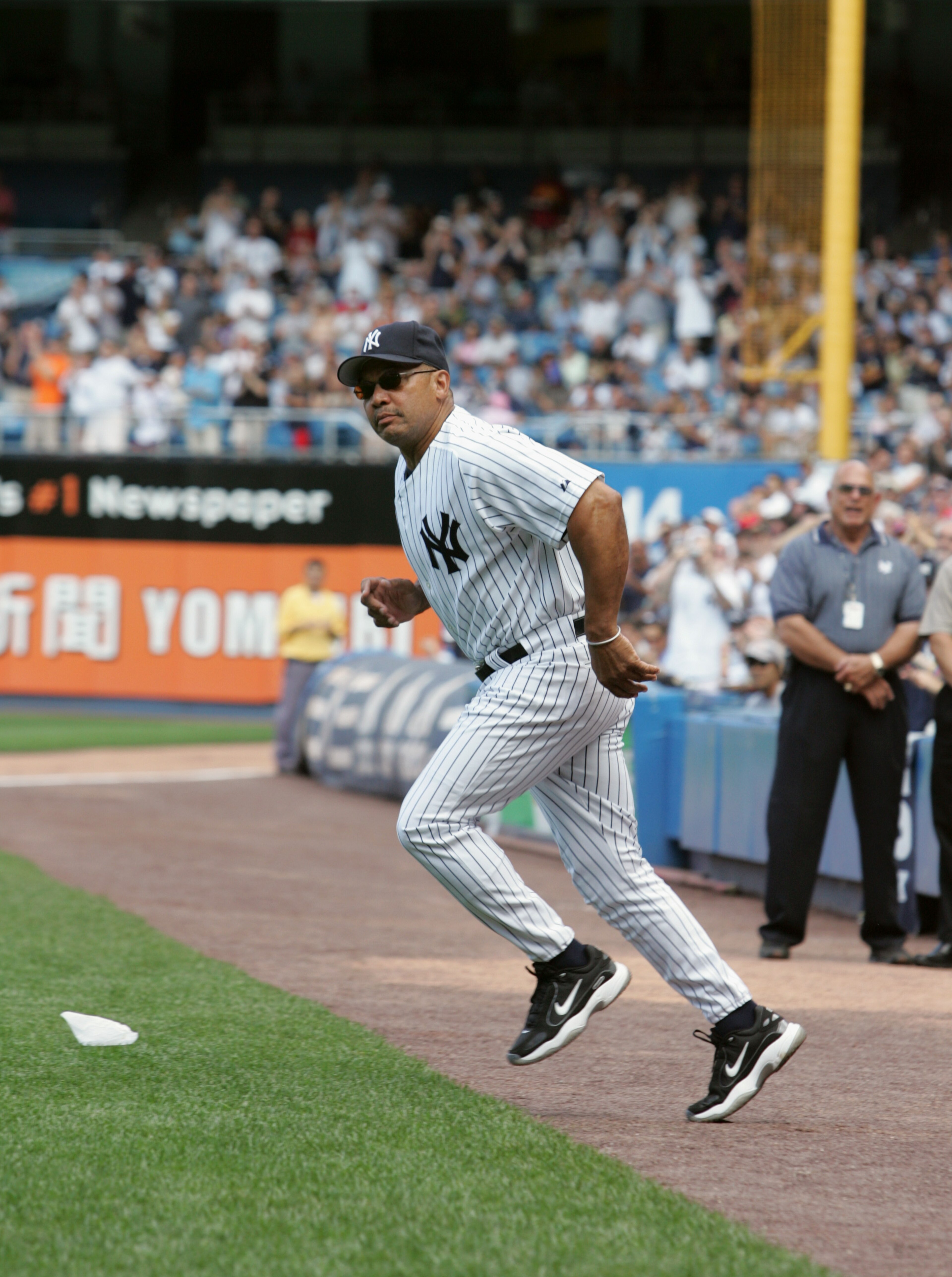 NEW YORK - JULY 9:  Reggie Jackson runs onto the field during the New York Yankees 59th annual old-timers' day before the start of the Yankees game against the Cleveland Indians on July 9, 2005 at Yankee Stadium in the Bronx borough of New York City. The
