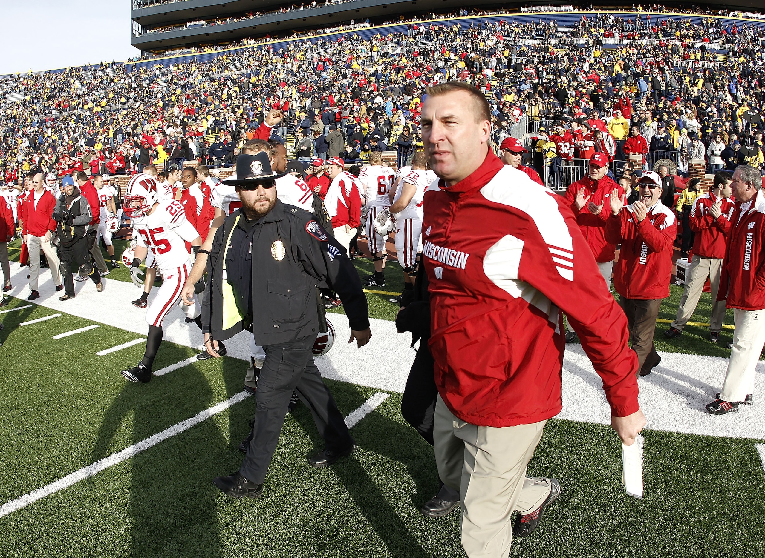ANN ARBOR, MI - NOVEMBER 20: Head coach Bret Bielema of the Wisconsin Badgers heads onto the field after defeating the Michigan Wolverines 48-28 at Michigan Stadium on November 20, 2010 in Ann Arbor, Michigan.  (Photo by Gregory Shamus/Getty Images)