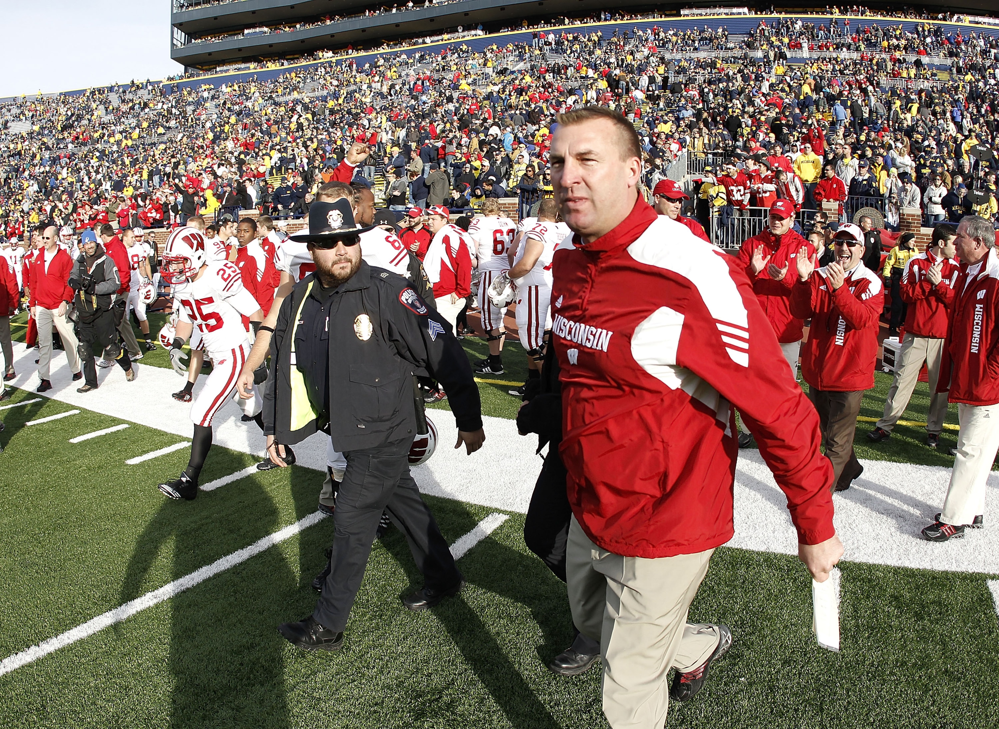 ANN ARBOR, MI - NOVEMBER 20: Head coach Bret Bielema of the Wisconsin Badgers heads onto the field after defeating the Michigan Wolverines 48-28 at Michigan Stadium on November 20, 2010 in Ann Arbor, Michigan.  (Photo by Gregory Shamus/Getty Images)