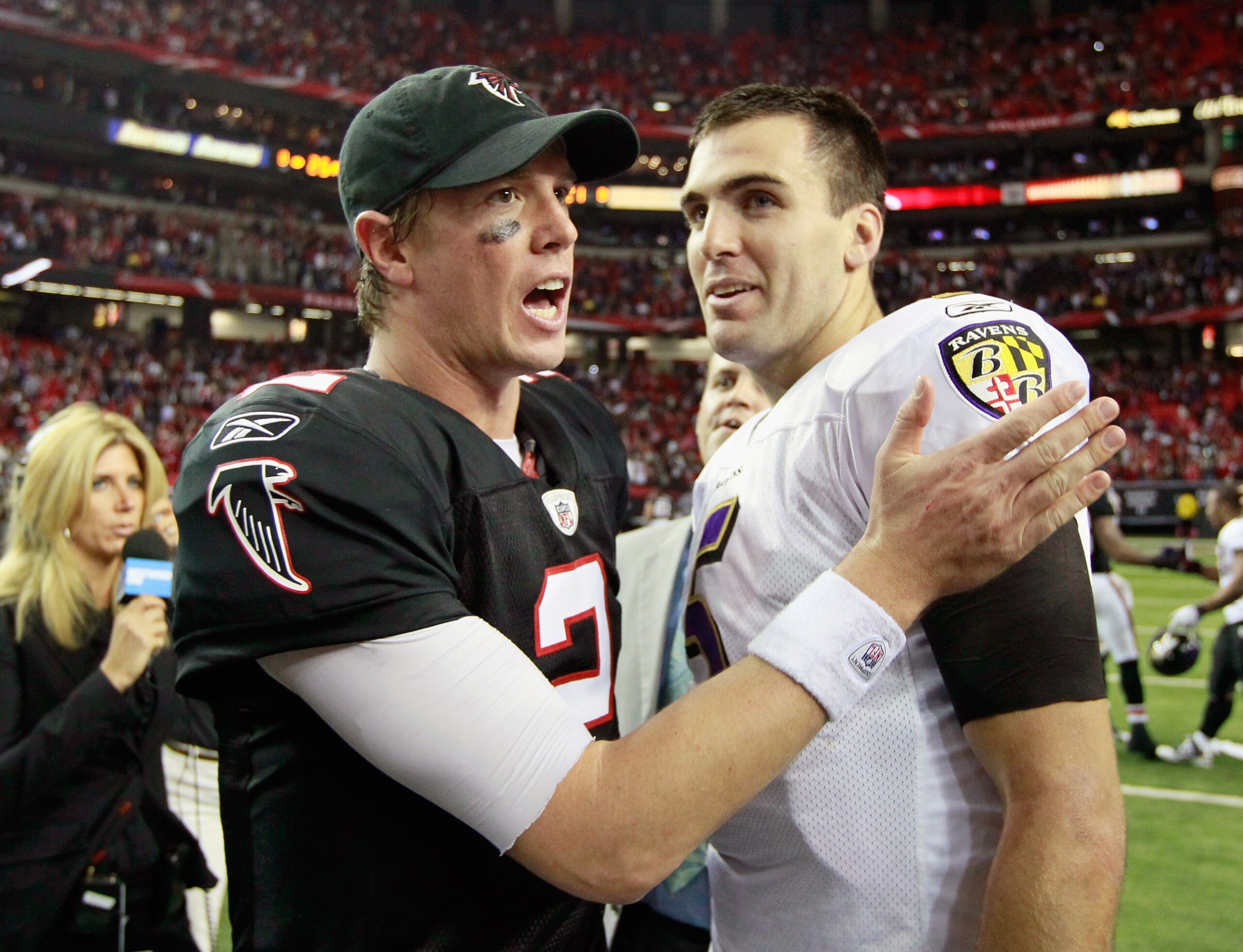 ATLANTA - NOVEMBER 11:  Quarterback Matt Ryan #2 of the Atlanta Falcons converses with quarterback Joe Flacco #5 of the Baltimore Ravens after the Falcons 26-21 win at Georgia Dome on November 11, 2010 in Atlanta, Georgia.  (Photo by Kevin C. Cox/Getty Im