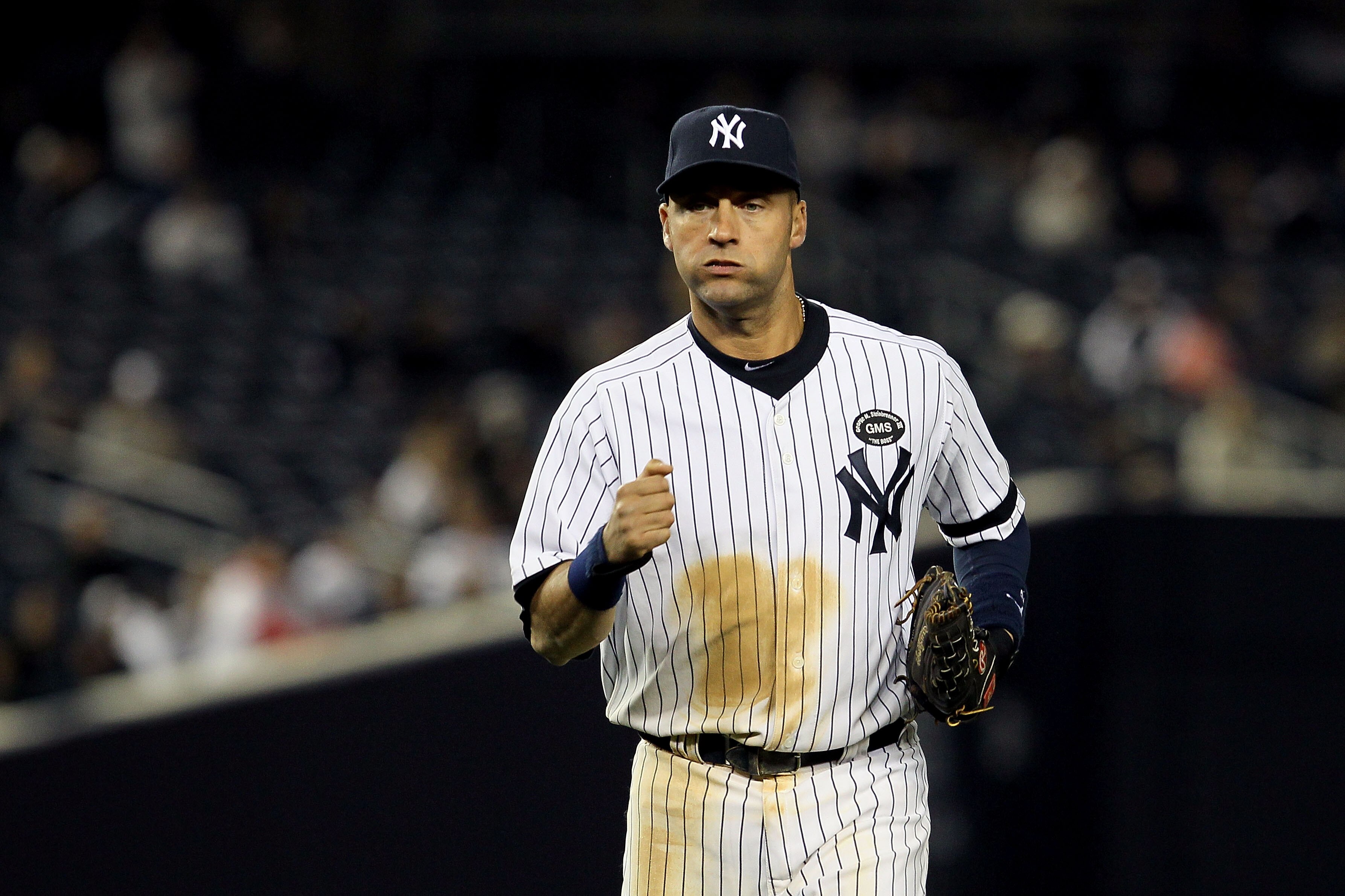 NEW YORK - OCTOBER 19:  Derek Jeter #2 of the New York Yankees runs back to the dugout against the Texas Rangers in Game Four of the ALCS during the 2010 MLB Playoffs at Yankee Stadium on October 19, 2010 in the Bronx borough of New York City. The Rangers