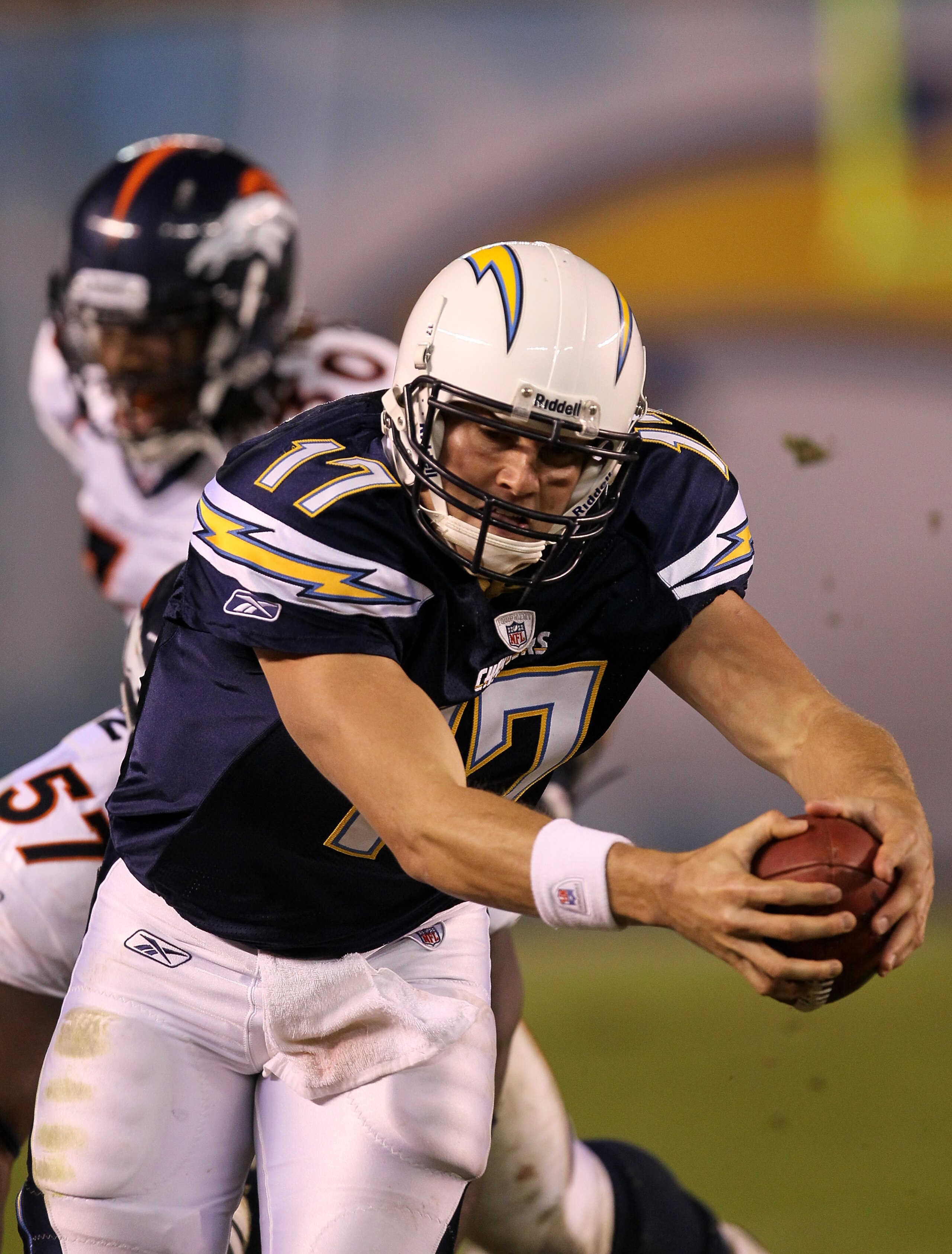 SAN DIEGO - NOVEMBER 22: Quarterback Philip Rivers #17 of the San Diego Chargers reaches the ball to the sideline down marker as he scrambles for a first down against the Denver Broncos at Qualcomm Stadium on November 22, 2010 in San Diego, California. T SAN DIEGO - NOVEMBER 22: Quarterback Philip Rivers #17 of the San Diego Chargers reaches the ball to the sideline down marker as he scrambles for a first down against the Denver Broncos at Qualcomm Stadium on November 22, 2010 in San Diego, California. T