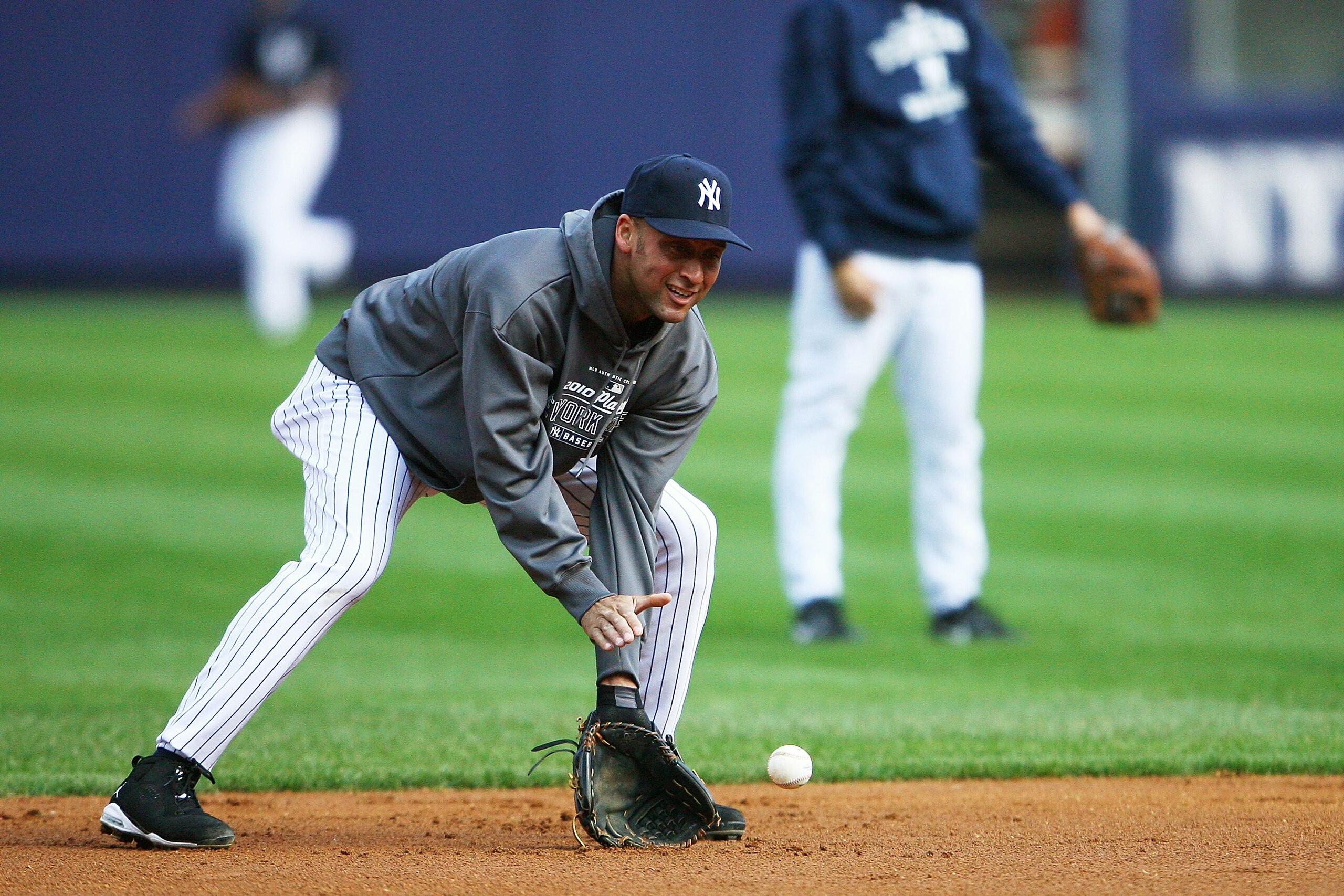 NEW YORK - OCTOBER 12: Derek Jeter #2 of the New York Yankees fields a ground ball during a workout session at Yankee Stadium on October 12, 2010 in the Bronx borough of New York City. (Photo by Andrew Burton/Getty Images) NEW YORK - OCTOBER 12: Derek Jeter #2 of the New York Yankees fields a ground ball during a workout session at Yankee Stadium on October 12, 2010 in the Bronx borough of New York City. (Photo by Andrew Burton/Getty Images)
