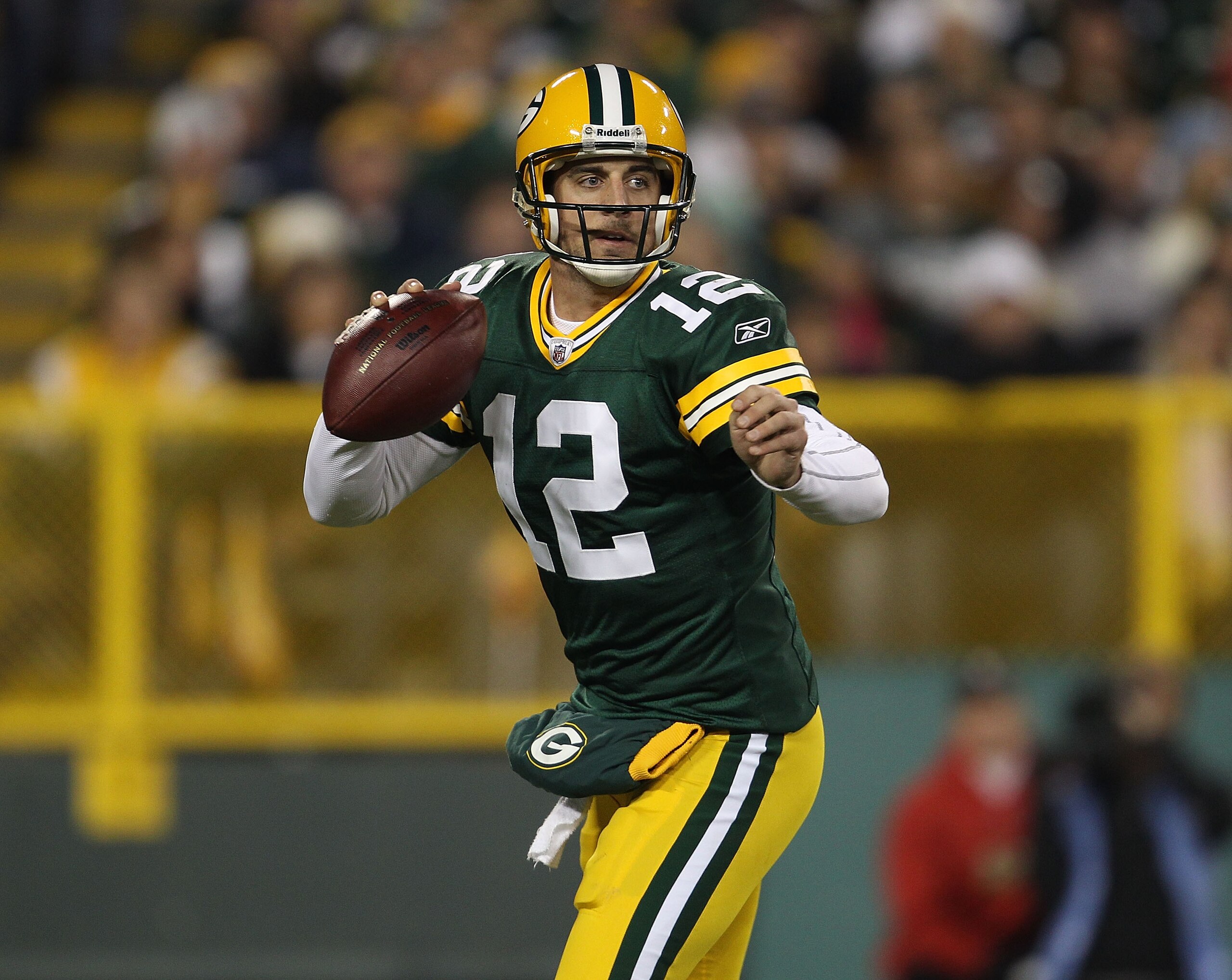 GREEN BAY, WI - NOVEMBER 07: Aaron Rodgers #12 of the Green Bay Packers looks for a receiver against the Dallas Cowboys at Lambeau Field on November 7, 2010 in Green Bay, Wisconsin. The Packers defeated the Cowboys 45-7. (Photo by Jonathan Daniel/Getty Im GREEN BAY, WI - NOVEMBER 07: Aaron Rodgers #12 of the Green Bay Packers looks for a receiver against the Dallas Cowboys at Lambeau Field on November 7, 2010 in Green Bay, Wisconsin. The Packers defeated the Cowboys 45-7. (Photo by Jonathan Daniel/Getty Im