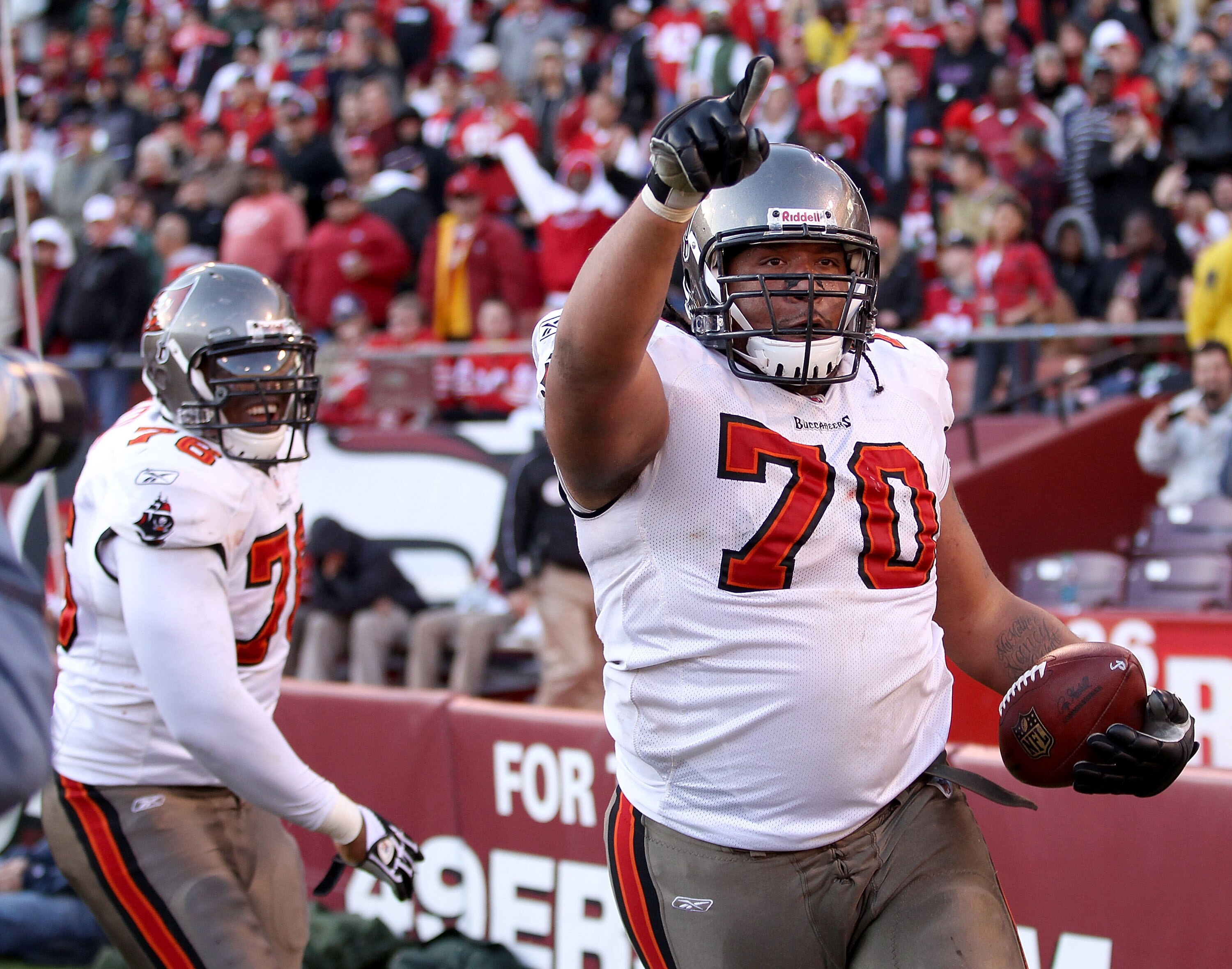 SAN FRANCISCO - NOVEMBER 21:  Donald Penn #70 of the Tampa Bay Buccaneers celebrates after he scored a touchdown against the San Francisco 49ers at Candlestick Park on November 21, 2010 in San Francisco, California.  (Photo by Ezra Shaw/Getty Images)