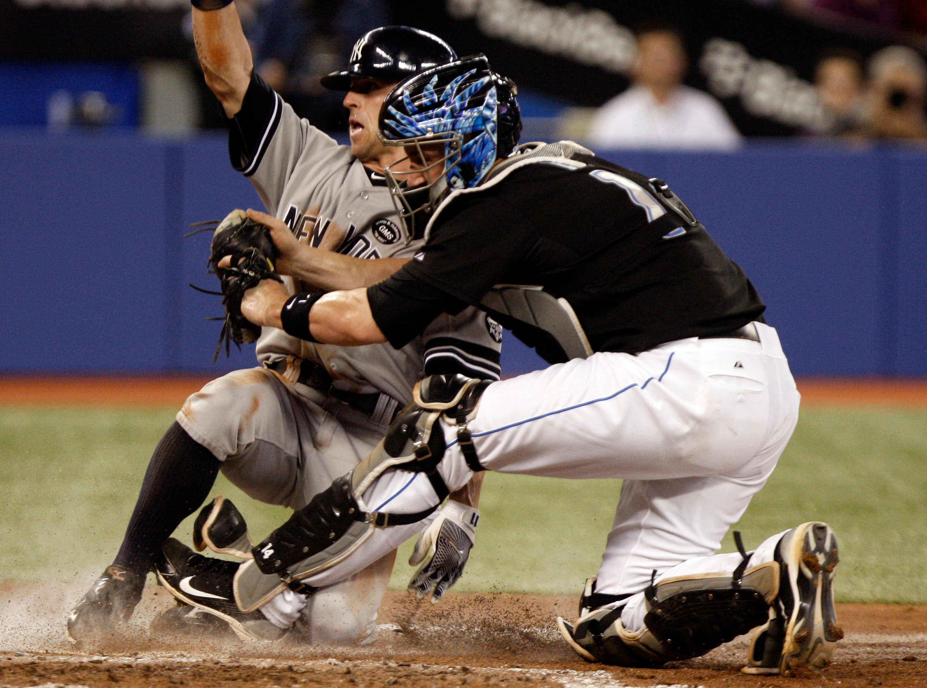 TORONTO, ON - SEPTEMBER 28: John Buck #14 of the Toronto Blue Jays thinks he tags out Brett Gardner #11of the New York Yankees during an MLB game at the Rogers Centre September 28, 2010 in Toronto, Ontario, Canada. (Photo by Abelimages/Getty Images)