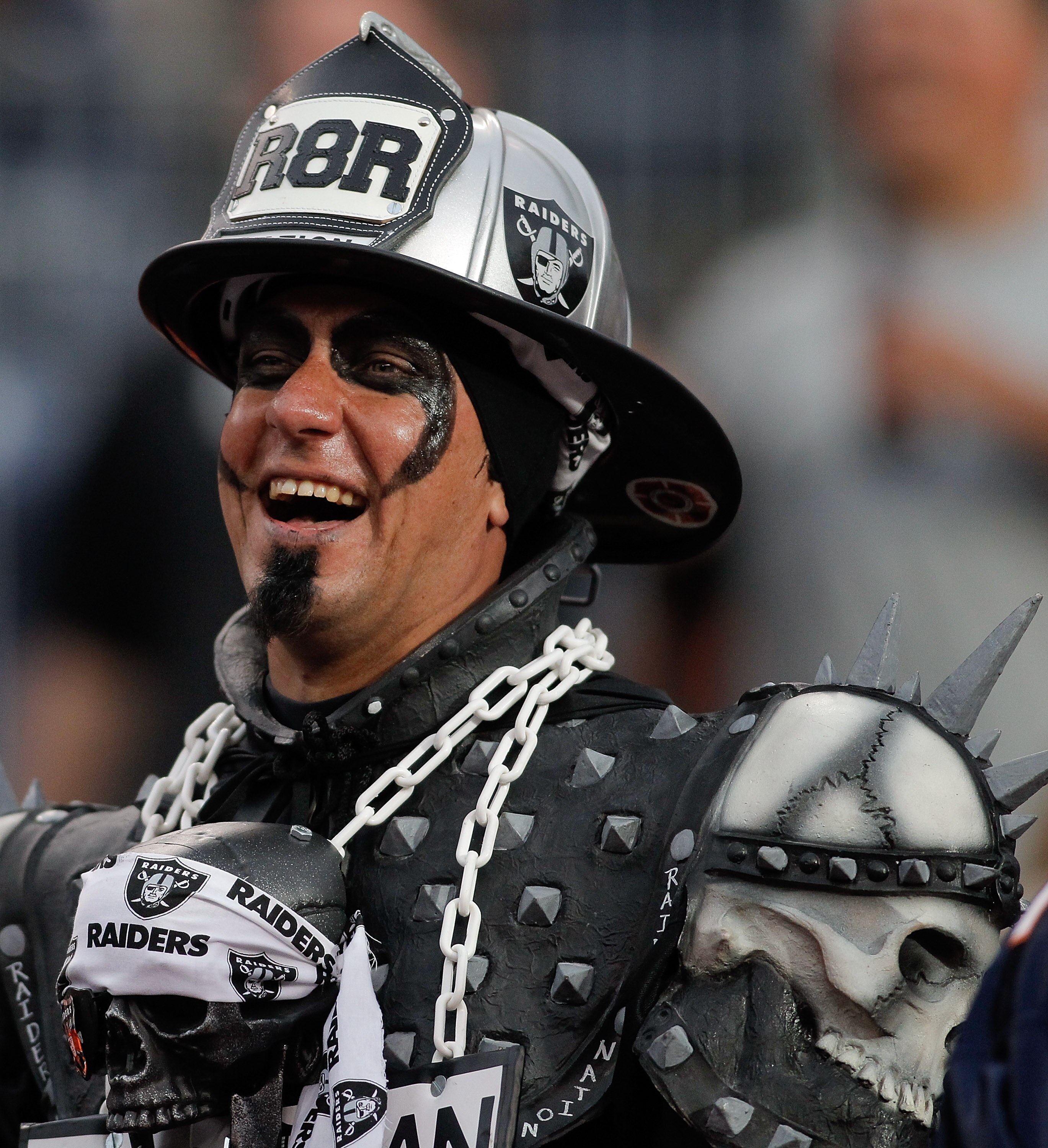 DENVER - OCTOBER 24:  An Oakland Raiders fan is all smiles during the Raiders 59-14 victory over the Denver Broncos at INVESCO Field at Mile High on October 24, 2010 in Denver, Colorado. (Photo by Justin Edmonds/Getty Images)
