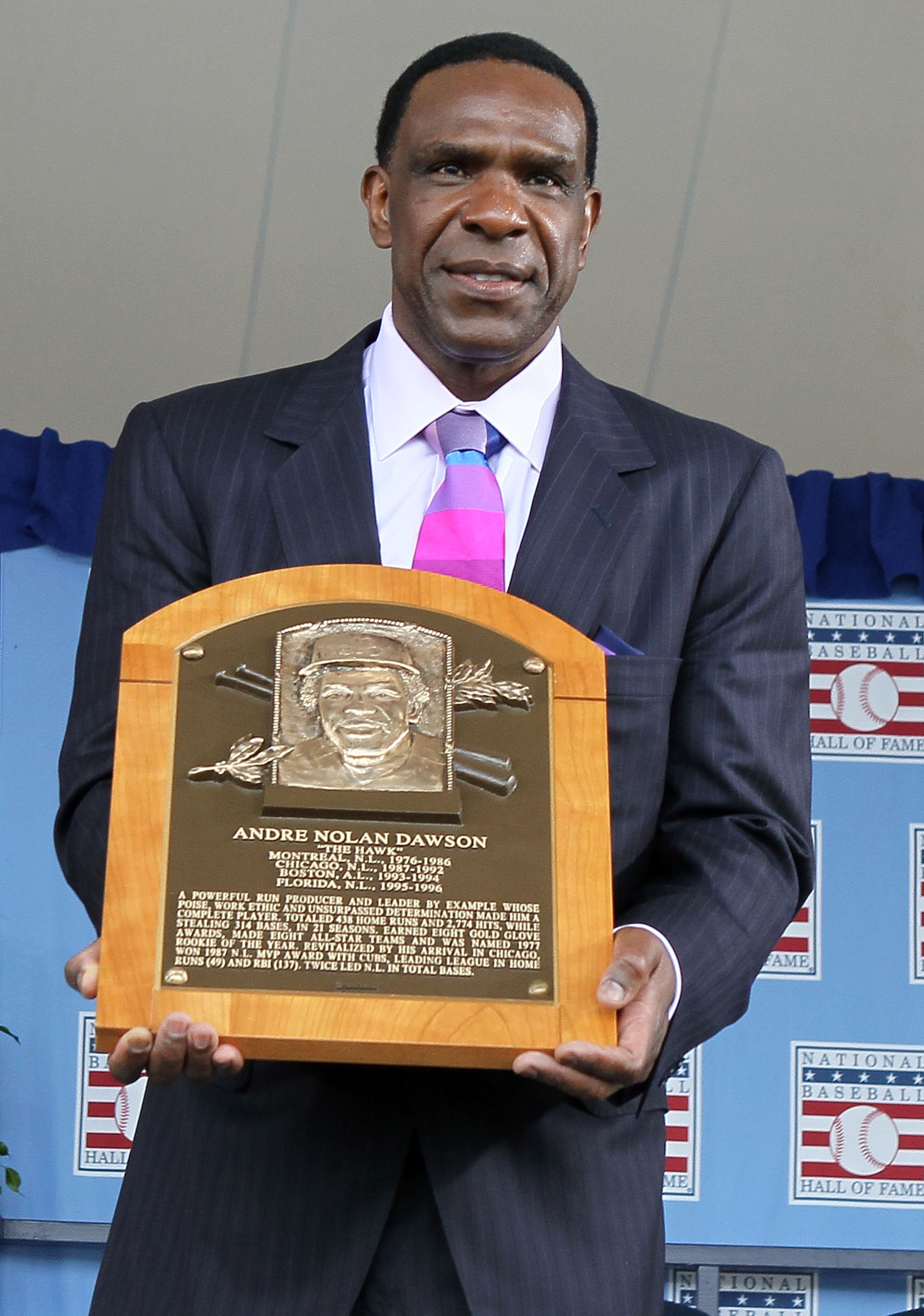 COOPERSTOWN, NY - JULY 25:  2010 inductee Andre Dawson poses for a photograph with his plaque at Clark Sports Center during the Baseball Hall of Fame induction ceremony on July 25, 20010 in Cooperstown, New York. Dawson was an eight time all-star during h