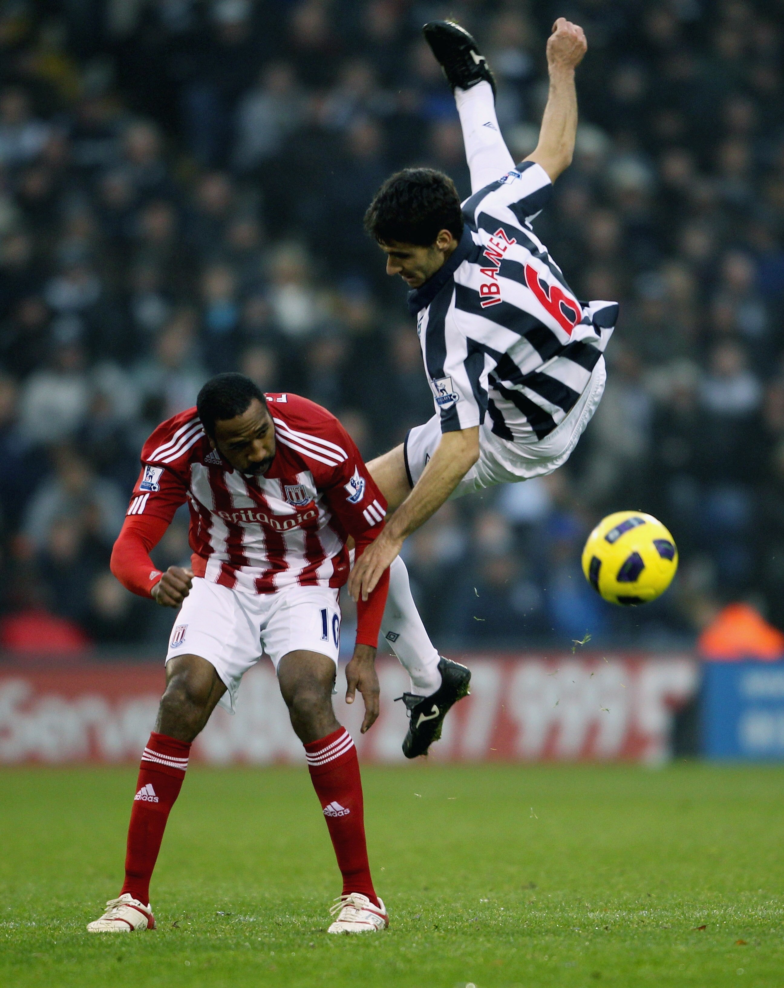 WEST BROMWICH, ENGLAND - NOVEMBER 20: Ricardo Fuller of Stoke (L) in action with Pablo Ibanez of West Brom during the Barclays Premier League match between West Bromwich Albion and Stoke City at The Hawthorns on November 20, 2010 in West Bromwich, England