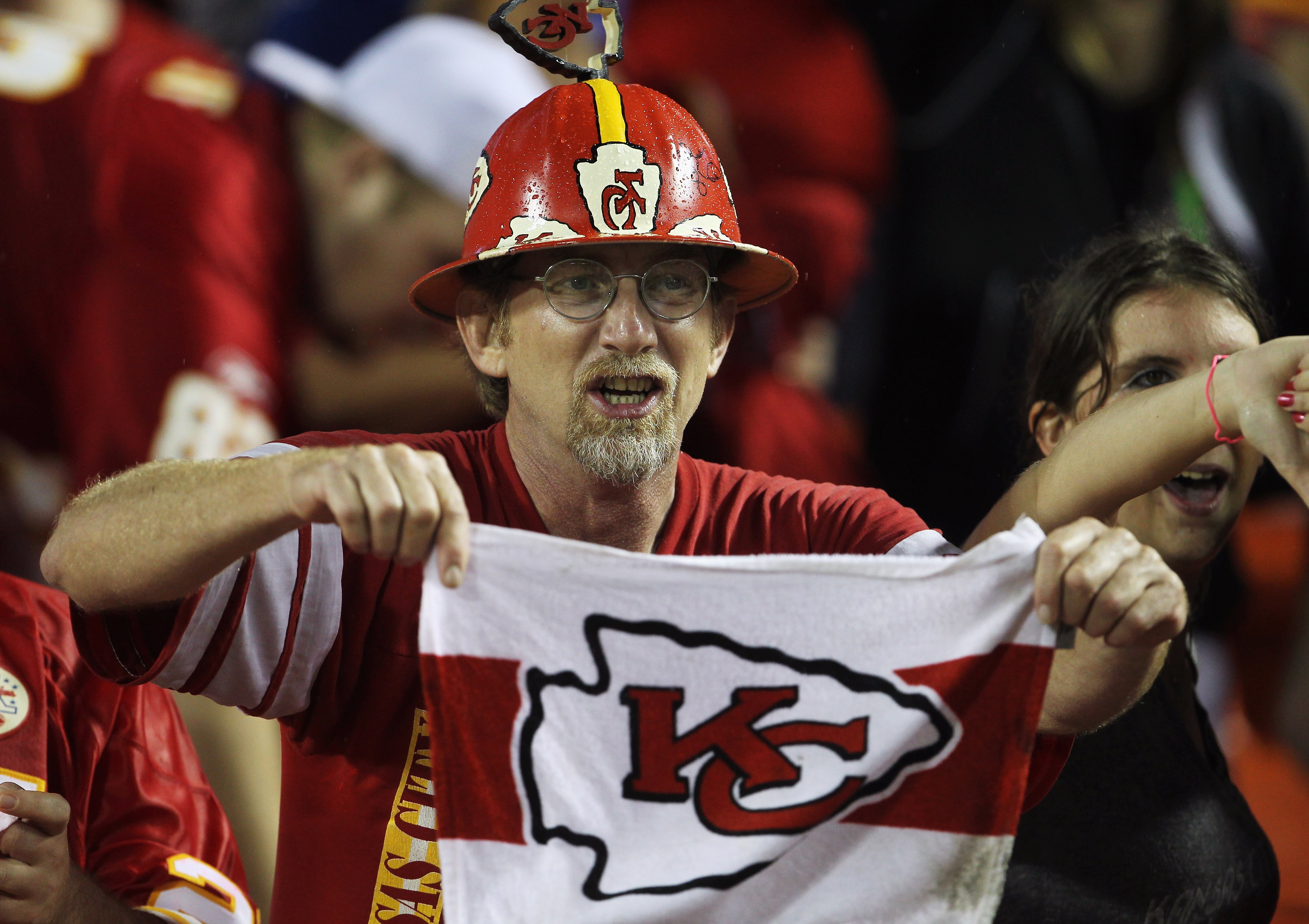 KANSAS CITY, MO - SEPTEMBER 13:  A Kansas City Chiefs fan cheers during the game against the San Diego Chargers on September 13, 2010 at Arrowhead Stadium in Kansas City, Missouri.  (Photo by Jamie Squire/Getty Images)