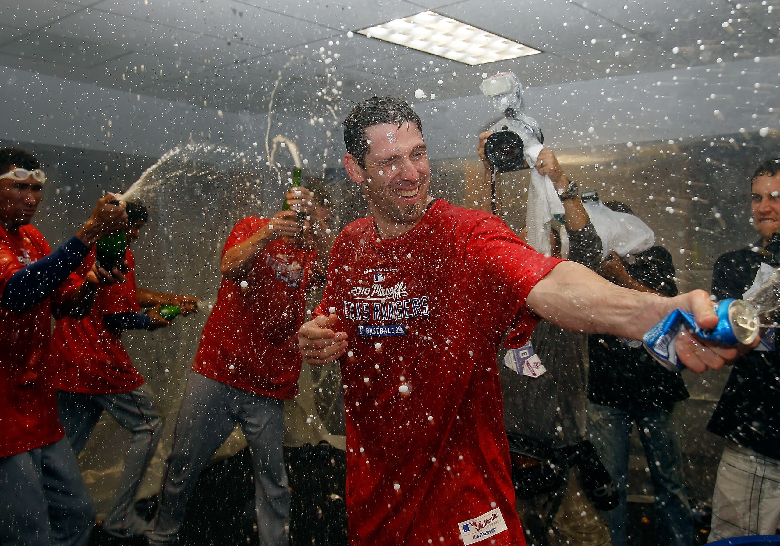 ST PETERSBURG, FL - OCTOBER 12:  :  Pitcher Cliff Lee #33 of the Texas Rangers celebrates his team's victory over the Tampa Bay Rays in Game 5 of the ALDS at Tropicana Field on October 12, 2010 in St. Petersburg, Florida.  (Photo by J. Meric/Getty Images)