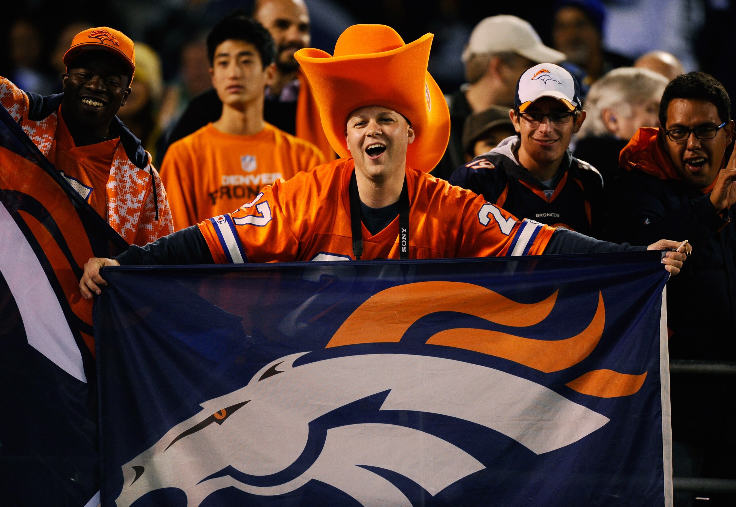 SAN DIEGO - NOVEMBER 22: A Denver Bronco fan cheers during the NFL football game against San Diego Chargers at Qualcomm Stadium on November 22, 2010 in San Diego, California. (Photo by Kevork Djansezian/Getty Images) SAN DIEGO - NOVEMBER 22: A Denver Bronco fan cheers during the NFL football game against San Diego Chargers at Qualcomm Stadium on November 22, 2010 in San Diego, California. (Photo by Kevork Djansezian/Getty Images)