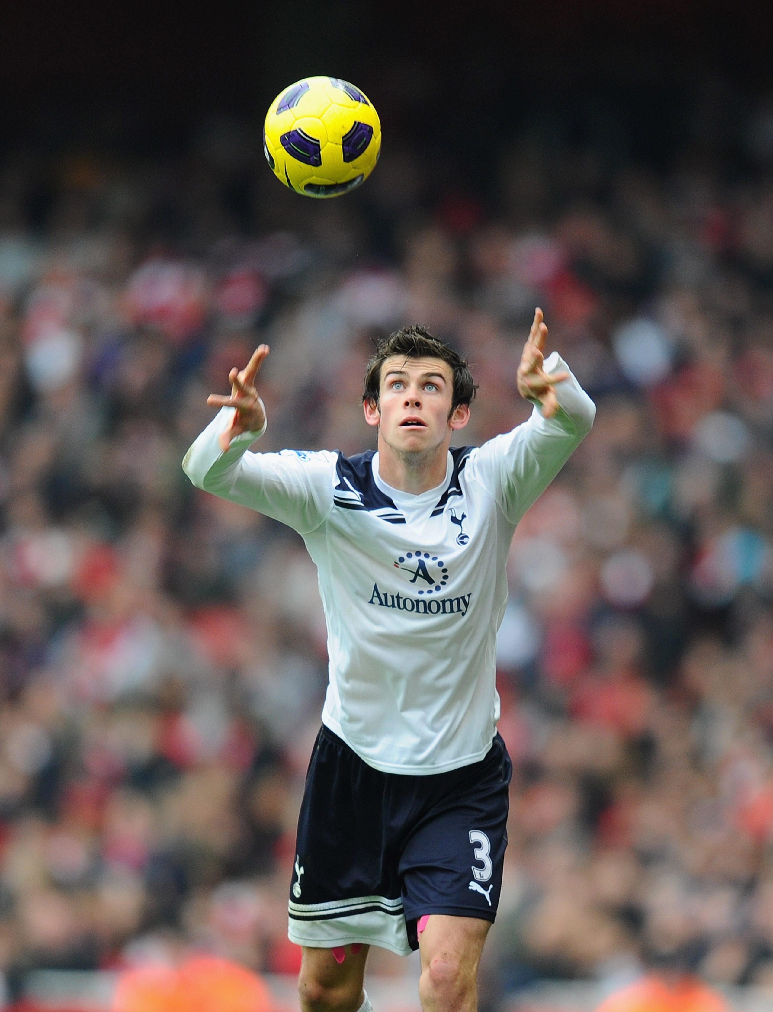 LONDON, ENGLAND - NOVEMBER 20:  Gareth Bale of Tottenham takes a throw in during the Barclays Premier League match between Arsenal and Tottenham Hotspur at the Emirates Stadium on November 20, 2010 in London, England.  (Photo by Mike Hewitt/Getty Images)