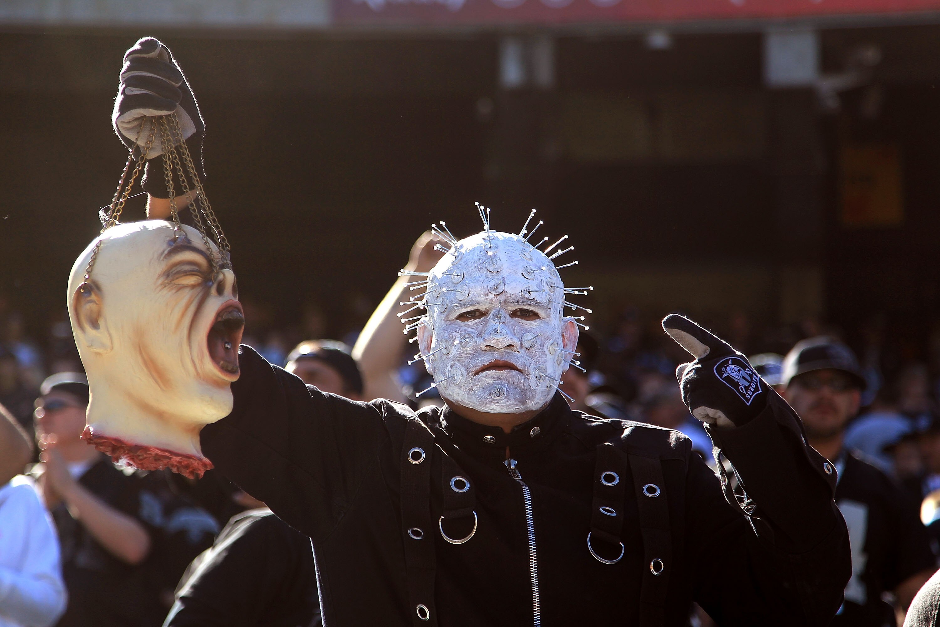 OAKLAND, CA - OCTOBER 31:  A fan holds up a fake head before the Seattle Seahawks game against the Oakland Raiders at Oakland-Alameda County Coliseum on October 31, 2010 in Oakland, California.  (Photo by Ezra Shaw/Getty Images)