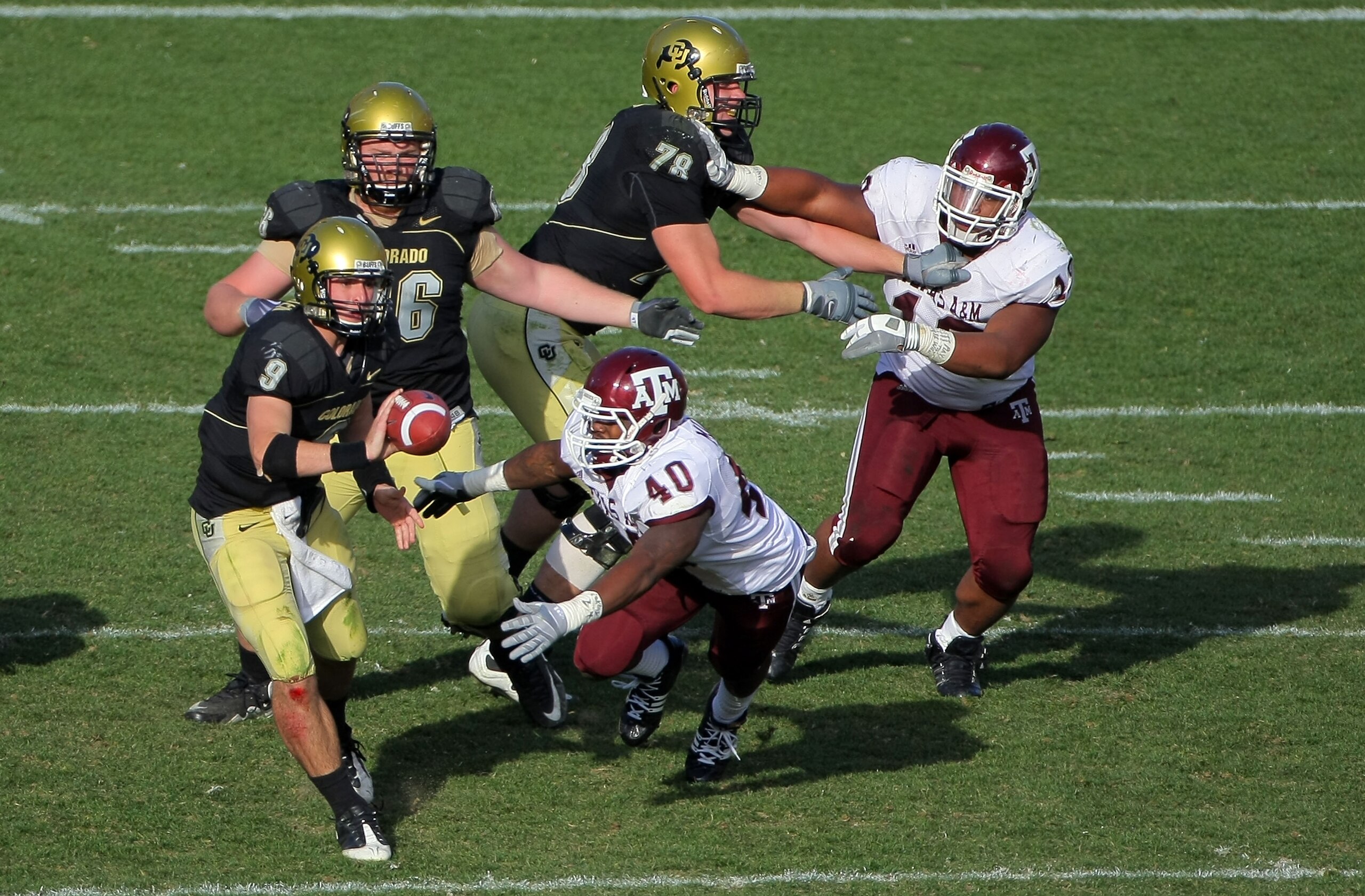 BOULDER, CO - NOVEMBER 07:  Quarterback Tyler Hansen #9 of the Colorado Buffaloes delivers a shovel pass against the Texas A&M Aggies during NCAA college football action at Folsom Field on November 7, 2009 in Boulder, Colorado. Colorado defeated Texas A&M