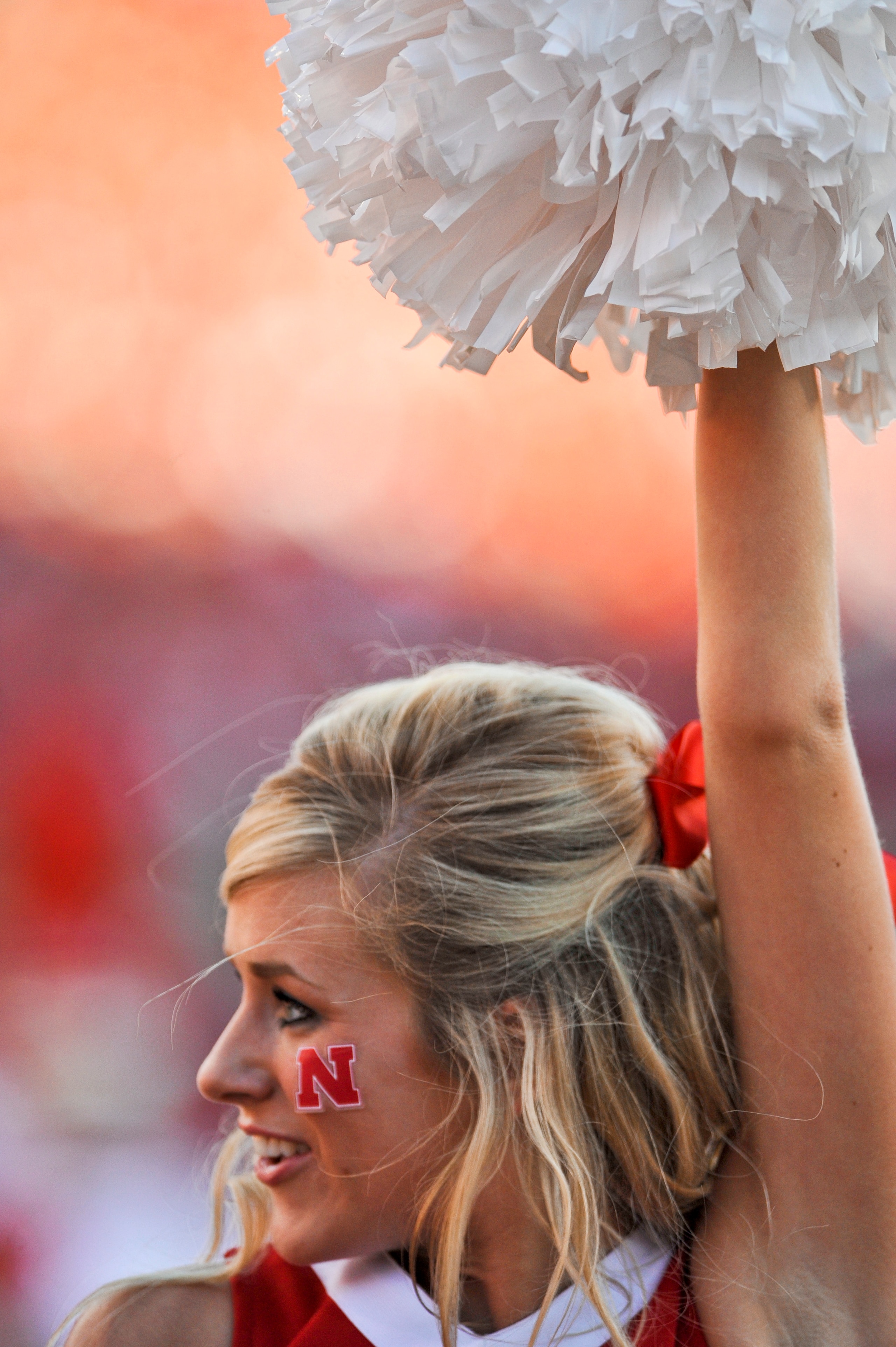LINCOLN, NE - SEPTEMBER 04:   A Nebraska cheerleader performs before kickoff of the opening game between the Western Kentucky Hilltoppers and the Nebraska Cornhuskers at Memorial Stadium on September 4, 2010 in Lincoln, Nebraska.  Nebraska defeated Wester