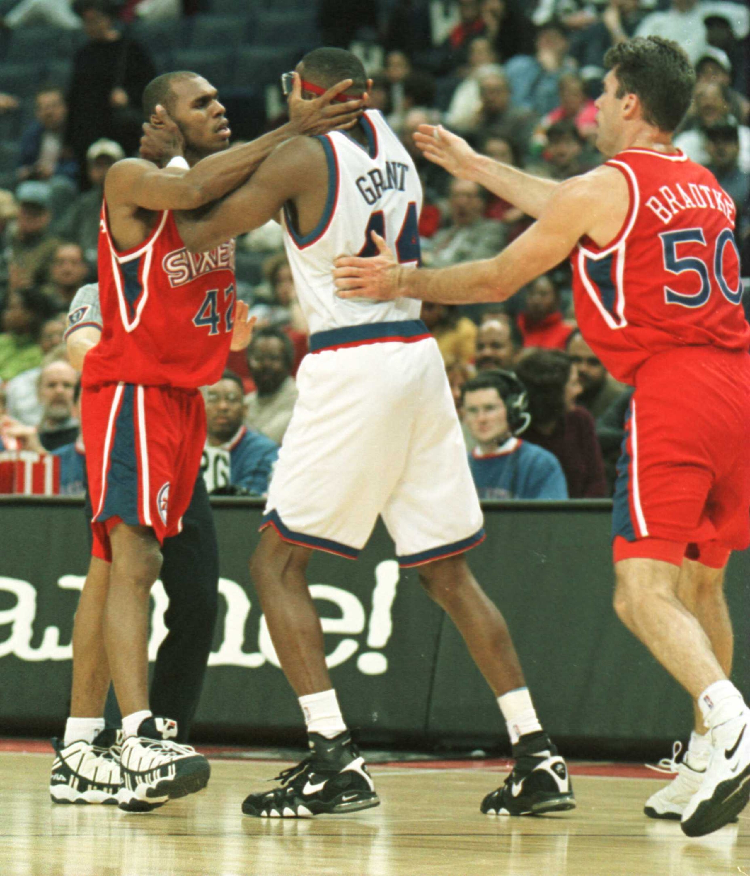 22 Nov 1996: Guard #42 Jerry Stackhouse of the Philadelphia 76ers and #44 Harvey Grant of the Washington Bullets square off after a foul by Grant as the Bullets defeated the 76ers 88-76 at the US AIr Arena in Landover, Maryland. #50 Mark Bradtke prepares 22 Nov 1996: Guard #42 Jerry Stackhouse of the Philadelphia 76ers and #44 Harvey Grant of the Washington Bullets square off after a foul by Grant as the Bullets defeated the 76ers 88-76 at the US AIr Arena in Landover, Maryland. #50 Mark Bradtke prepares