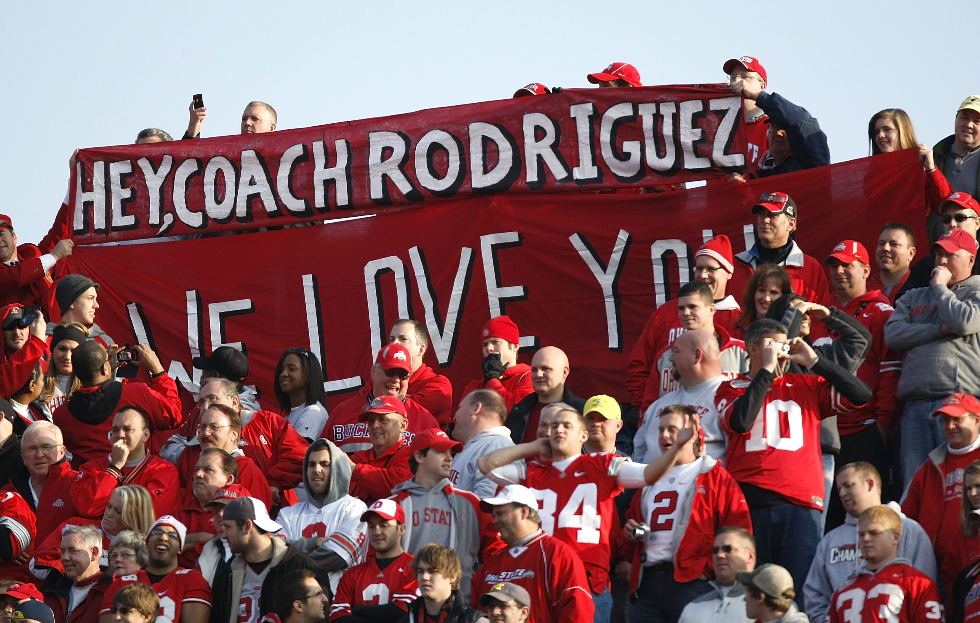 ANN ARBOR, MI - NOVEMBER 21: Fans of the Ohio State Buckeyes hold up a sign in support of head coach Rich Rodriguez of the Michigan Wolverines on November 21, 2009 at Michigan Stadium in Ann Arbor, Michigan. Ohio State won the game 21-10. (Photo by Gregor