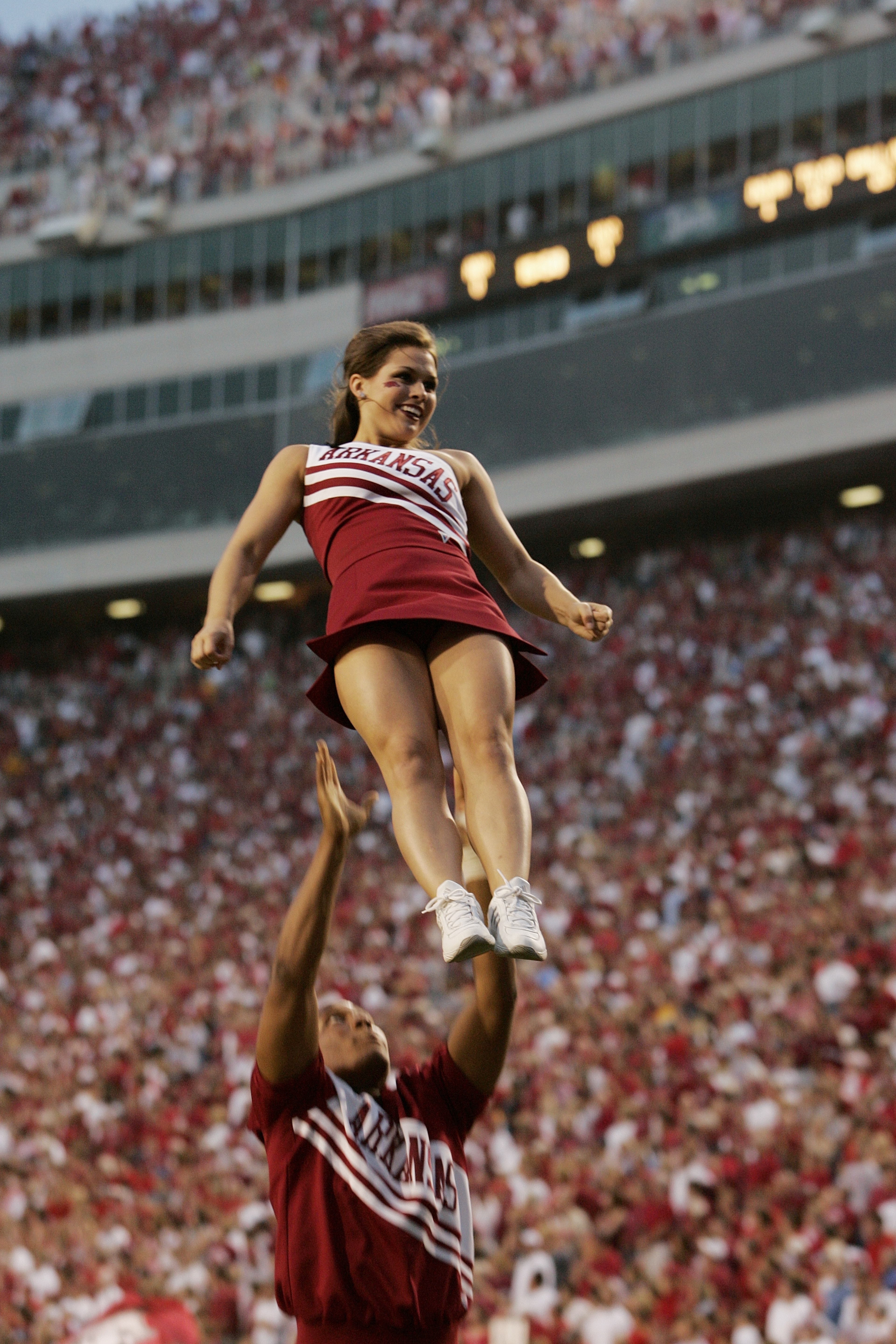 FAYETTEVILLE, AR - SEPTEMBER 2:  Cheerleaders of the Arkansas Razorbacks perform before the game against the University of Southern California Trojans on September 2, 2006 at Donald W. Reynolds Razorback Stadium in Fayetteville, Arkansas.  Southern Califo