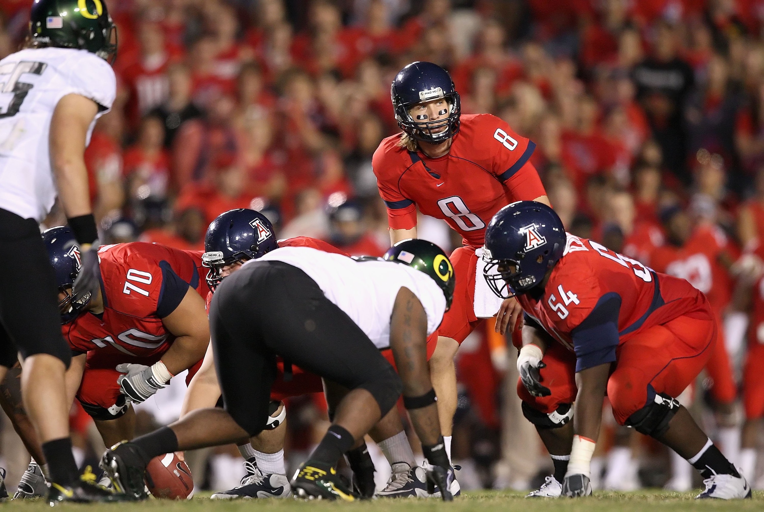 TUCSON, AZ - NOVEMBER 21:  Quarterback Nick Foles #8 of the Arizona Wildcats prepares to snap the ball against the Oregon Ducks during the college football game at Arizona Stadium on November 21, 2009 in Tucson, Arizona.  The Ducks defeated the Wildcats 4
