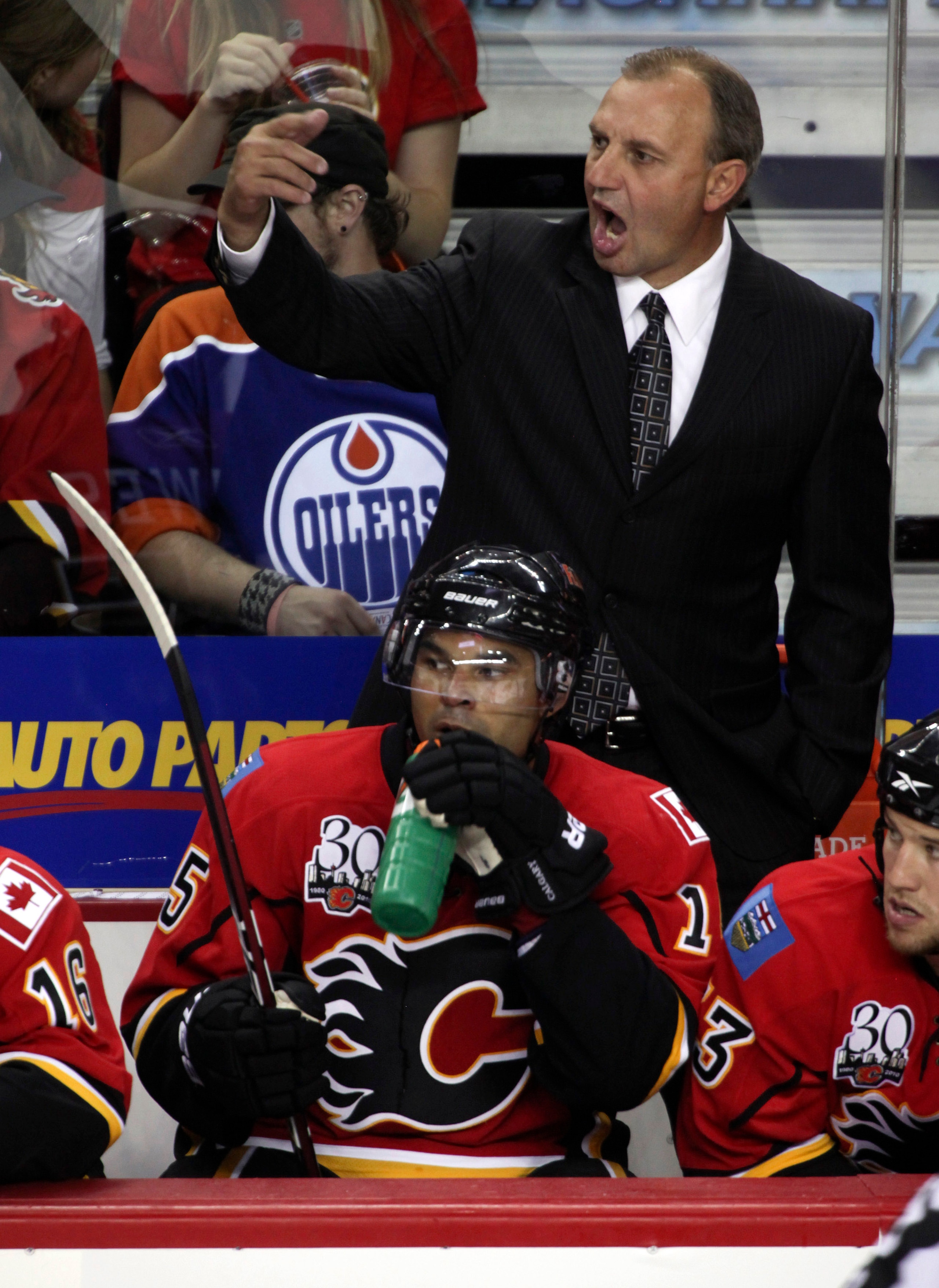CALGARY, CANADA - SEPTEMBER 15: Head coach Brent Sutter of the Calgary Flames yells from the bench during the third period against the Edmonton Oilers in NHL preseason action on September 15, 2009 at the Pengrowth Saddledome in Calgary, Alberta, Canada. ( CALGARY, CANADA - SEPTEMBER 15: Head coach Brent Sutter of the Calgary Flames yells from the bench during the third period against the Edmonton Oilers in NHL preseason action on September 15, 2009 at the Pengrowth Saddledome in Calgary, Alberta, Canada. (