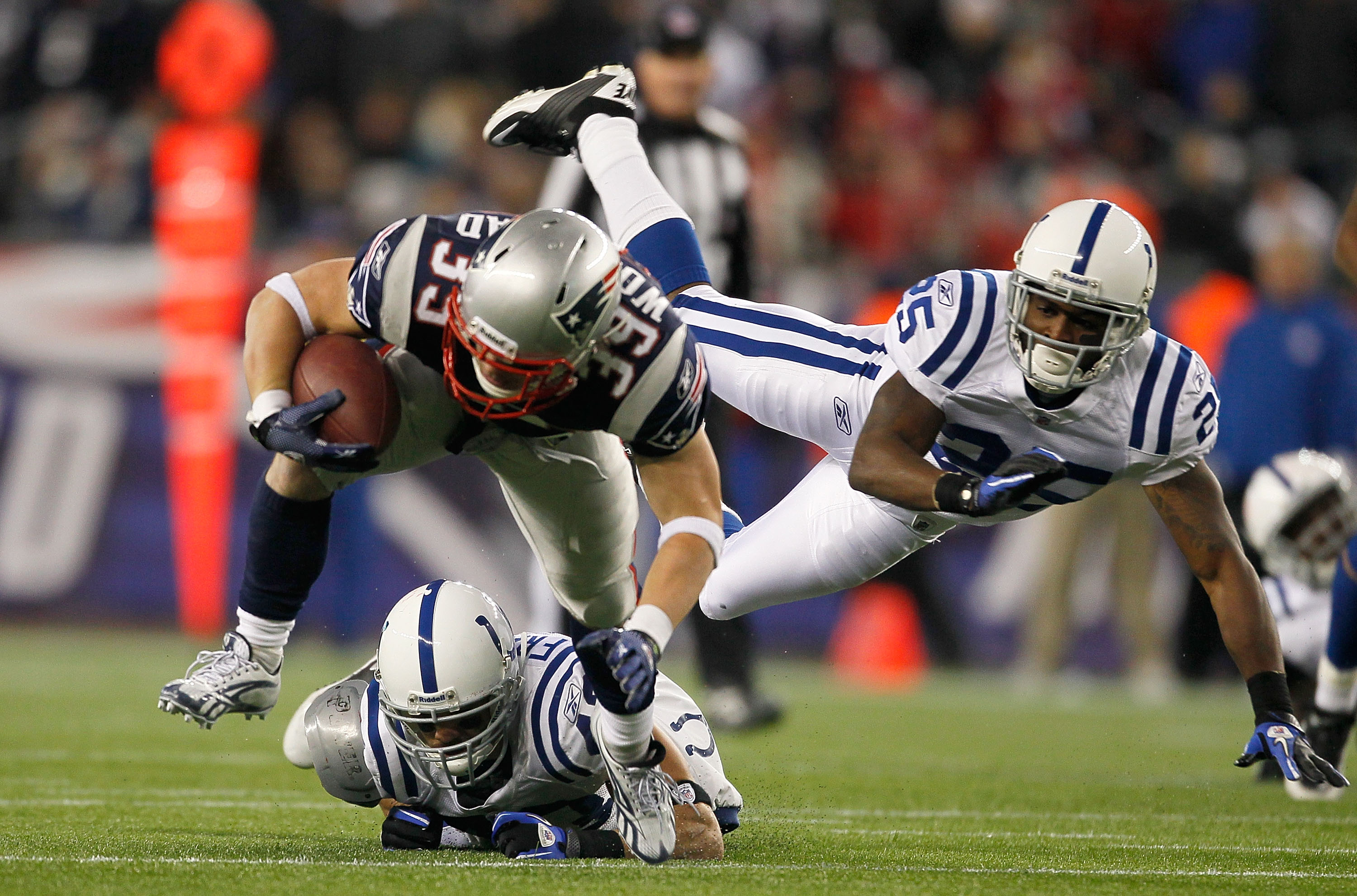 FOXBORO, MA - NOVEMBER 21:  Danny Woodhead #39 of the New England Patriots gains yards despite the defense Jerraud Powers #25  and Aaron Francisco #43 of the Indianapolis Coltsat Gillette Stadium on November 21, 2010 in Foxboro, Massachusetts. The Patriot