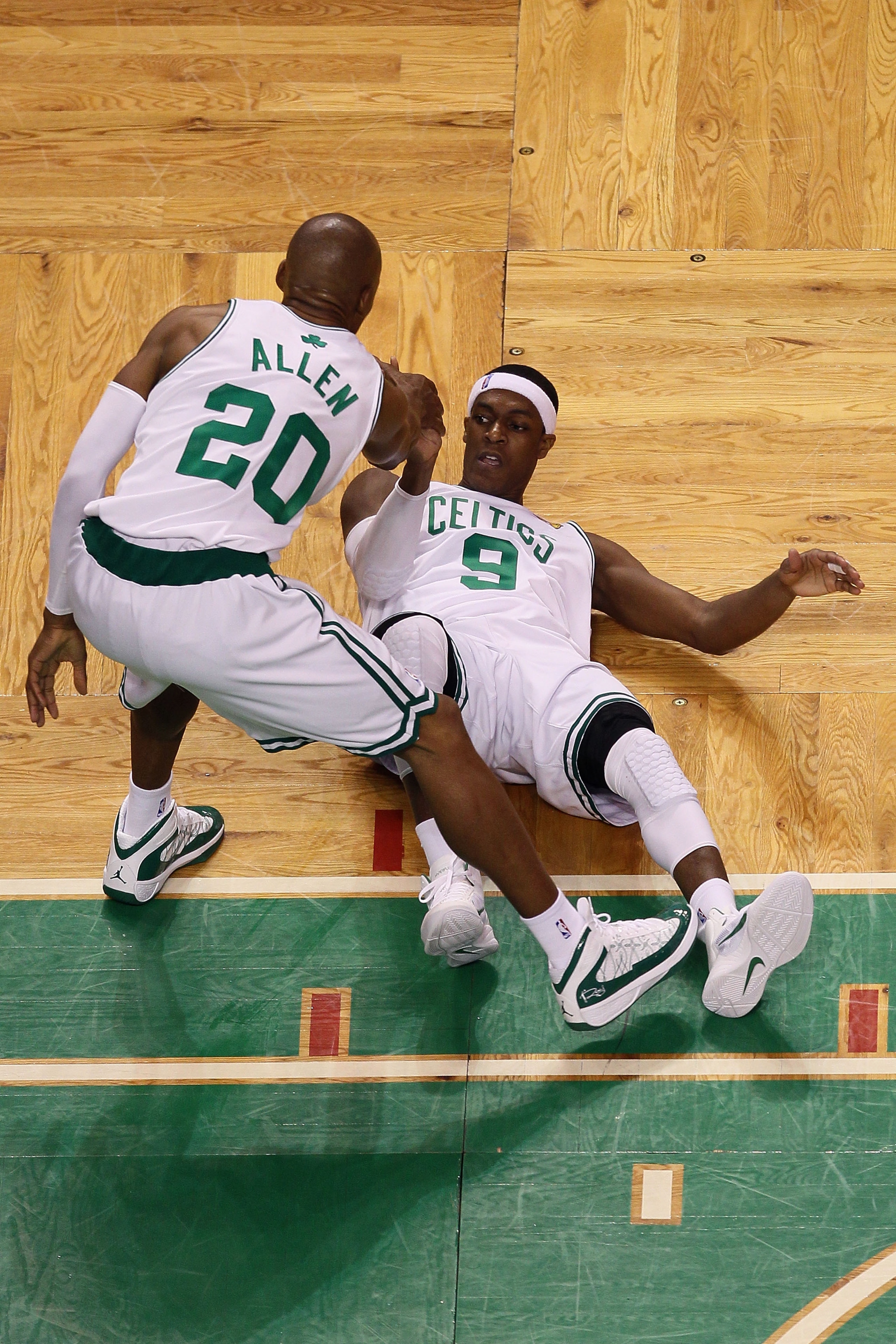 BOSTON - JUNE 13: Rajon Rondo #9 of the Boston Celtics is helped up off the floor by teammate Ray Allen #20 during Game Five of the 2010 NBA Finals against the Los Angeles Lakers on June 13, 2010 at TD Garden in Boston, Massachusetts. NOTE TO USER: User BOSTON - JUNE 13: Rajon Rondo #9 of the Boston Celtics is helped up off the floor by teammate Ray Allen #20 during Game Five of the 2010 NBA Finals against the Los Angeles Lakers on June 13, 2010 at TD Garden in Boston, Massachusetts. NOTE TO USER: User