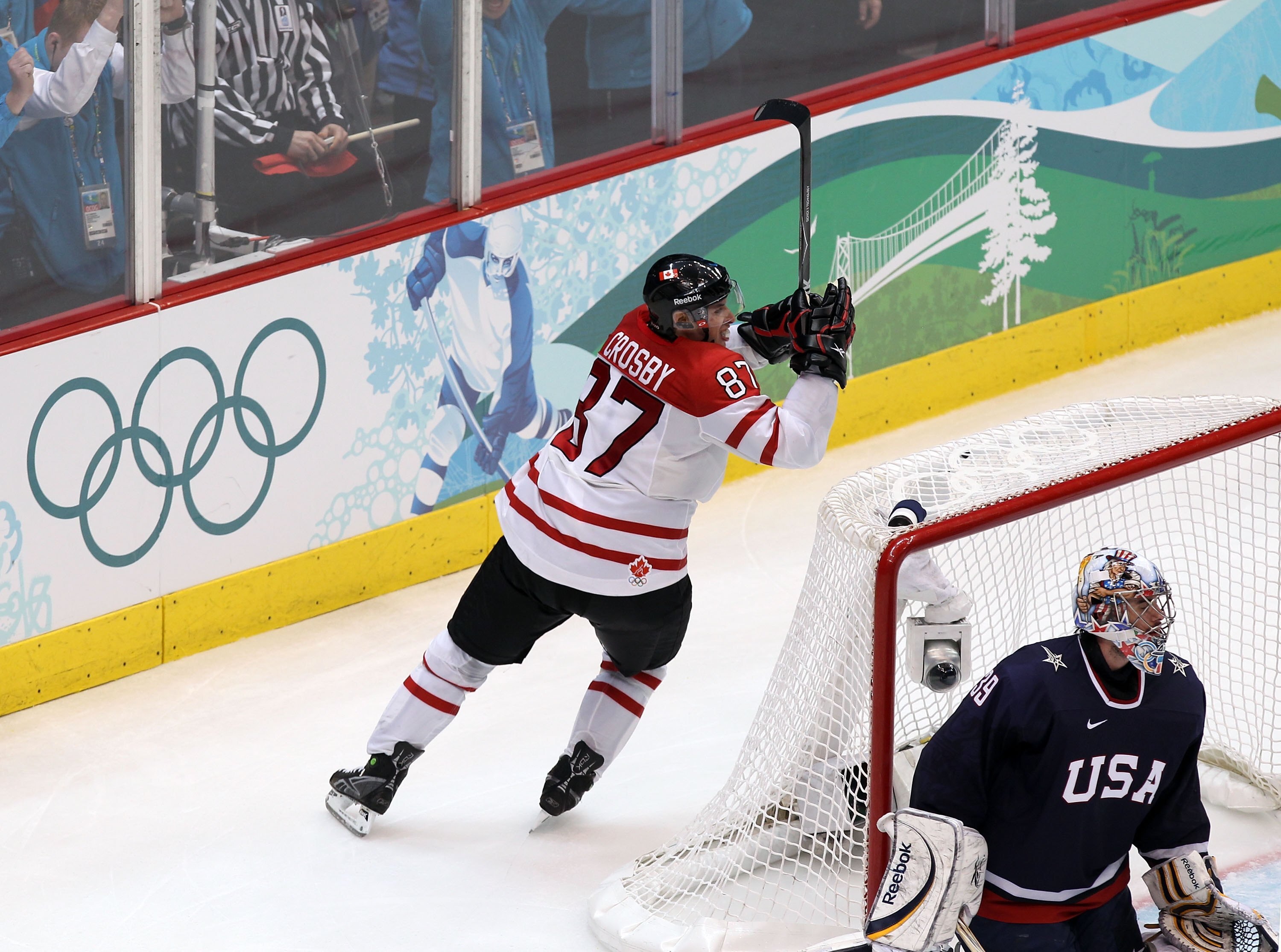 VANCOUVER, BC - FEBRUARY 28:  Sidney Crosby #87 of Canada starts to celebrate after scoring the game-winning goal in overtime against Ryan Miller #39 of USA  in the ice hockey men's gold medal game between USA and Canada on day 17 of the Vancouver 2010 Wi
