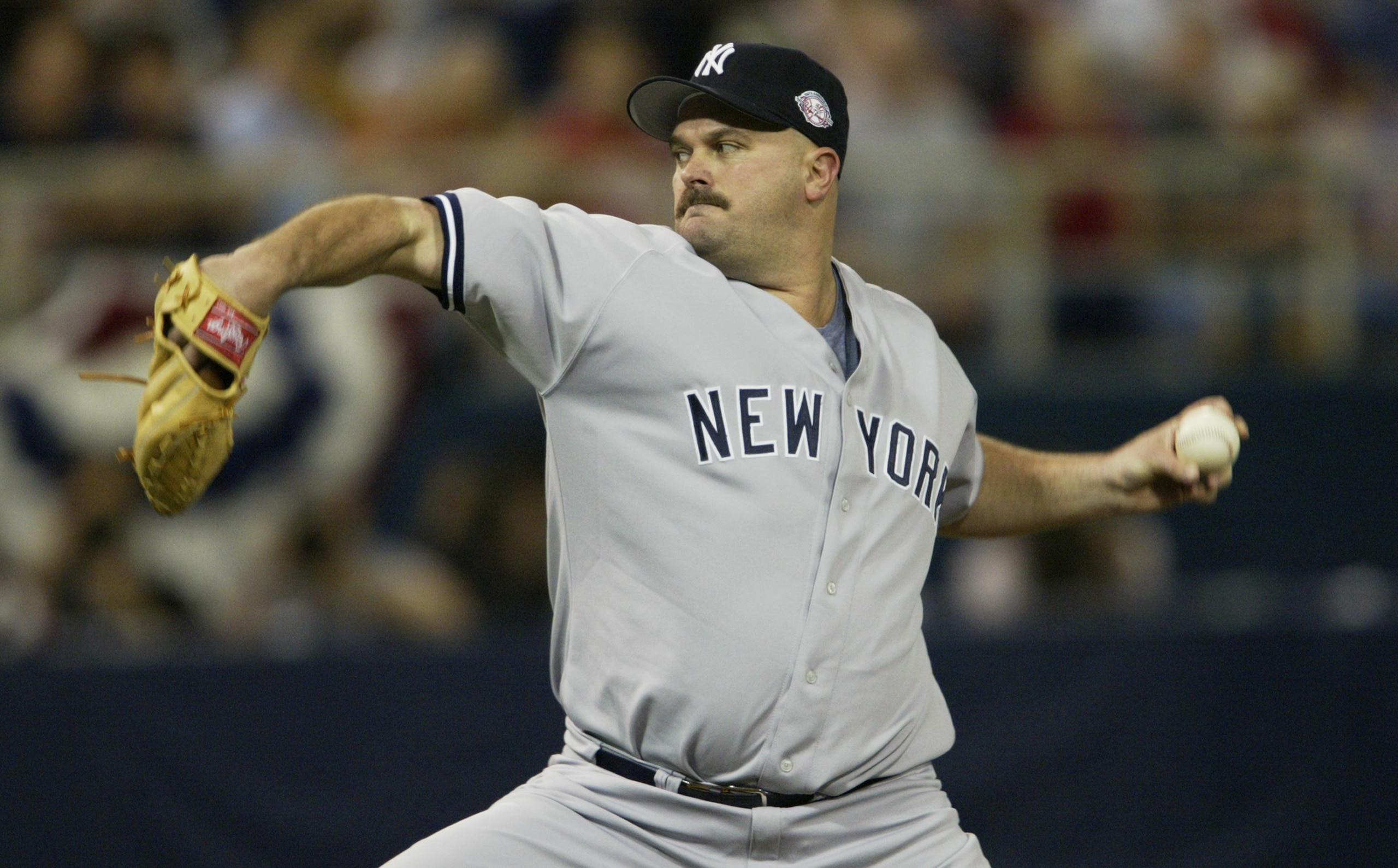 MINNEAPOLIS - OCTOBER 5:  Starting pitcher David Wells #33 of the New York Yankees pitches during the American League Division Series against the Minnesota Twins on October 5, 2003 at the Hubert H. Humphrey Metrodome in Minneapolis, Minnesota.  The Yankee