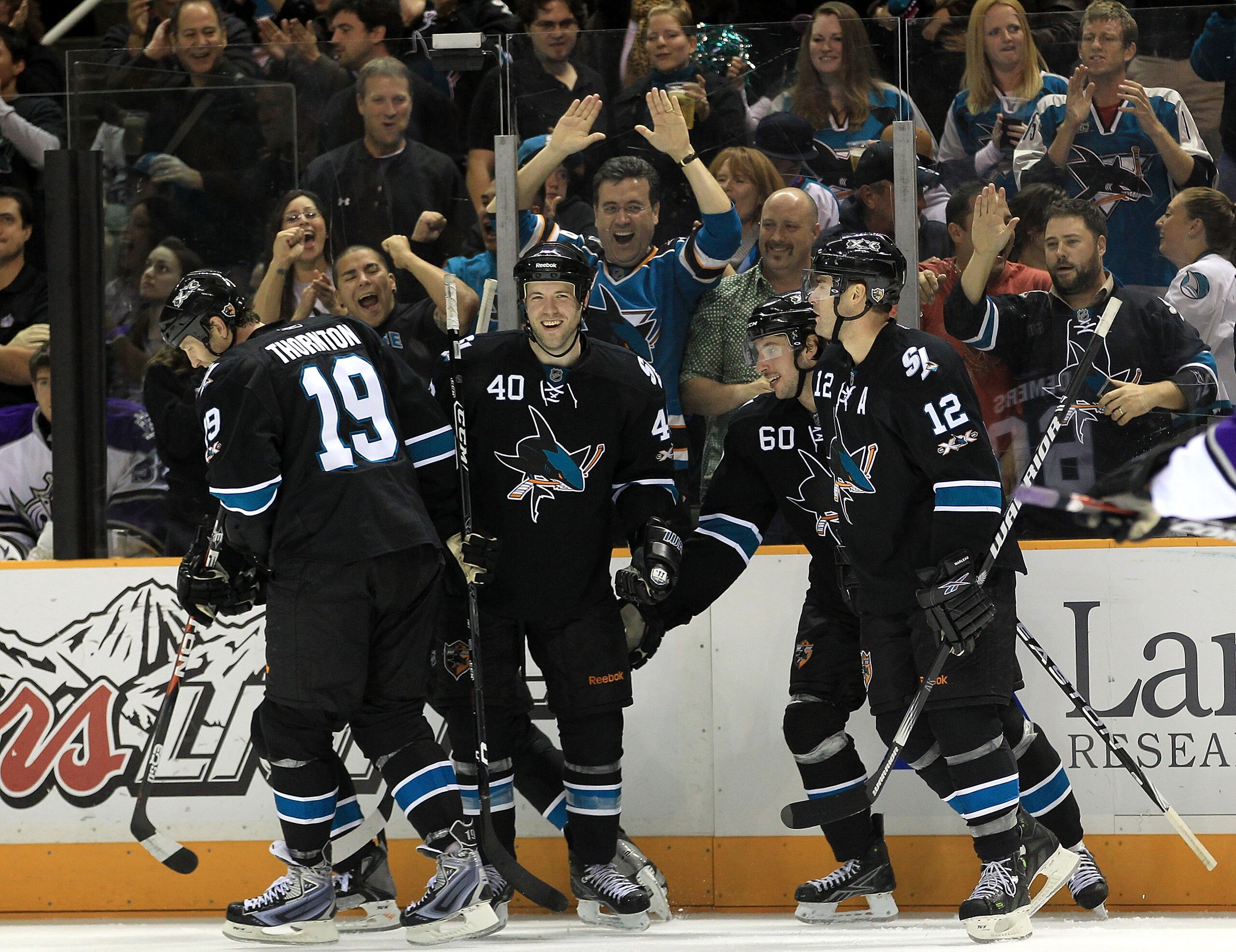 SAN JOSE, CA - NOVEMBER 15:  Dany Heatley #15 of the San Jose Sharks is congratulated by teammates Kent Huskins #40, Jason Demers #60, Patrick Marleau #12 and Joe Thornton #19 after he scored a goal during their game against the Los Angeles Kings at HP Pa