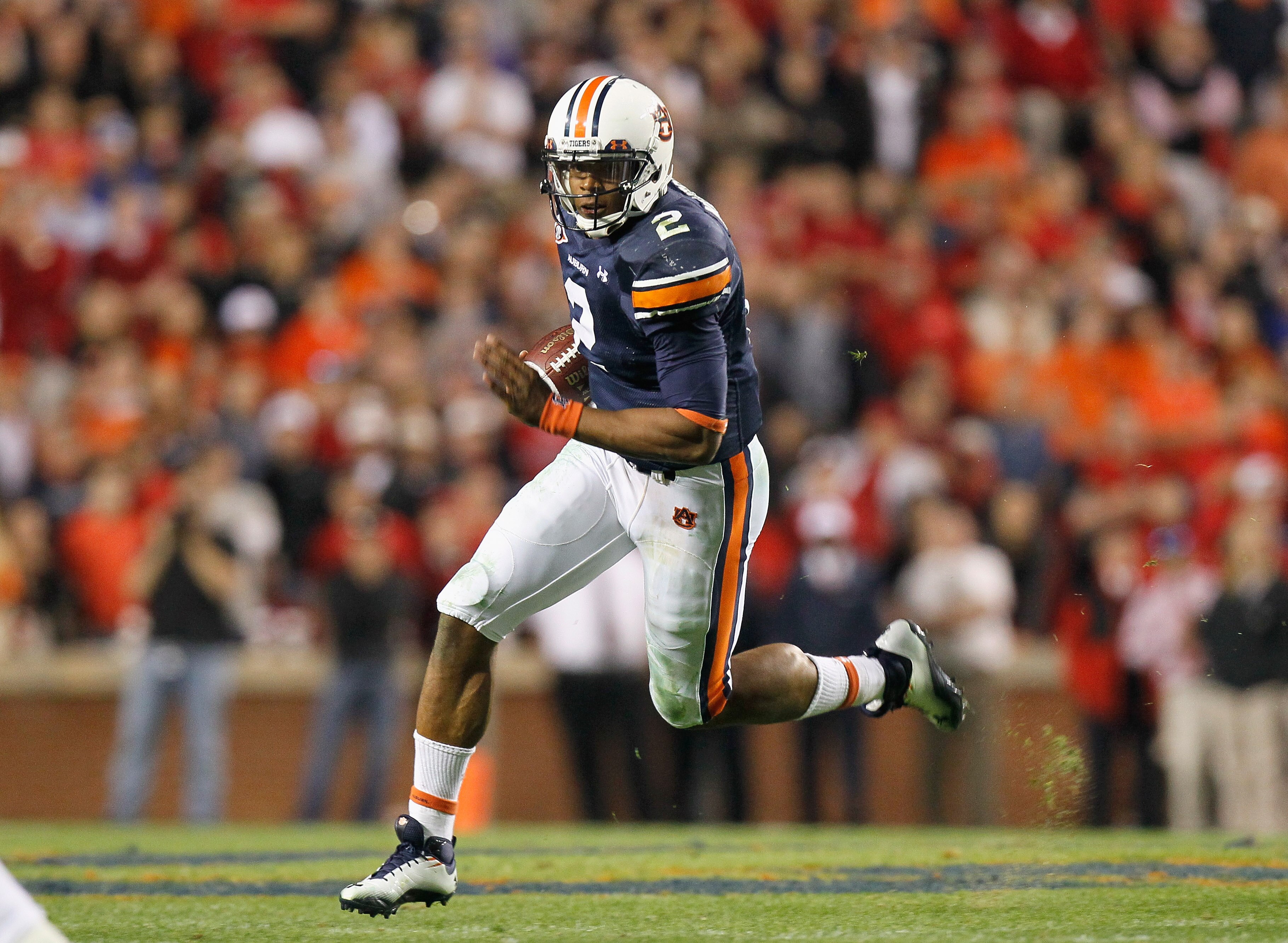 AUBURN, AL - NOVEMBER 13:  Quarterback Cameron Newton #2 of the Auburn Tigers rushes upfield against the Georgia Bulldogs at Jordan-Hare Stadium on November 13, 2010 in Auburn, Alabama.  (Photo by Kevin C. Cox/Getty Images)