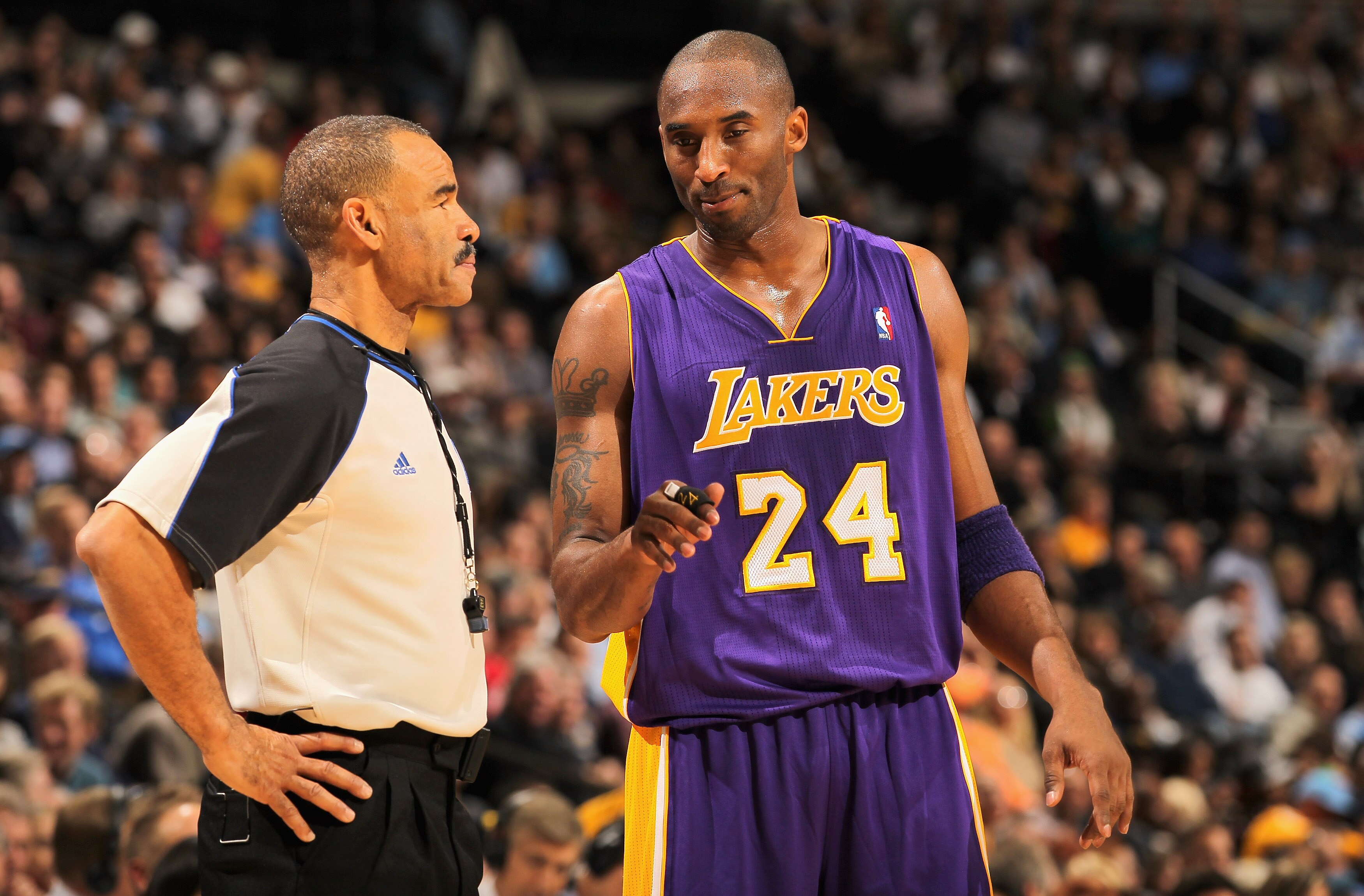 DENVER - NOVEMBER 11:  Kobe Bryant #24 of the Los Angeles Lakers discusses a call with referee Dan Crawford against the Denver Nuggets at the Pepsi Center on November 11, 2010 in Denver, Colorado. The Nuggets defeated the Lakers 118-112.  NOTE TO USER: Us