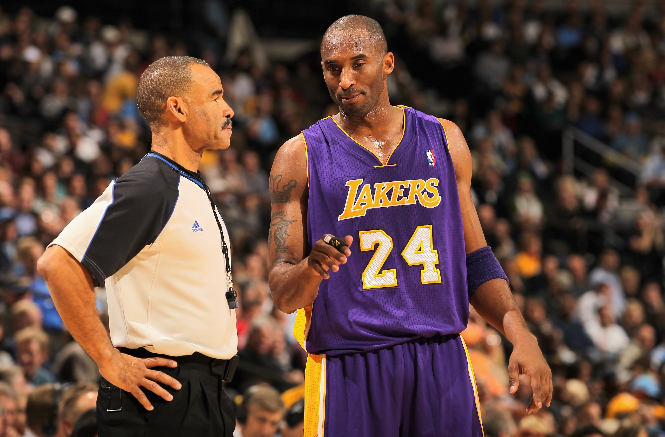 DENVER - NOVEMBER 11:  Kobe Bryant #24 of the Los Angeles Lakers discusses a call with referee Dan Crawford against the Denver Nuggets at the Pepsi Center on November 11, 2010 in Denver, Colorado. The Nuggets defeated the Lakers 118-112.  NOTE TO USER: Us