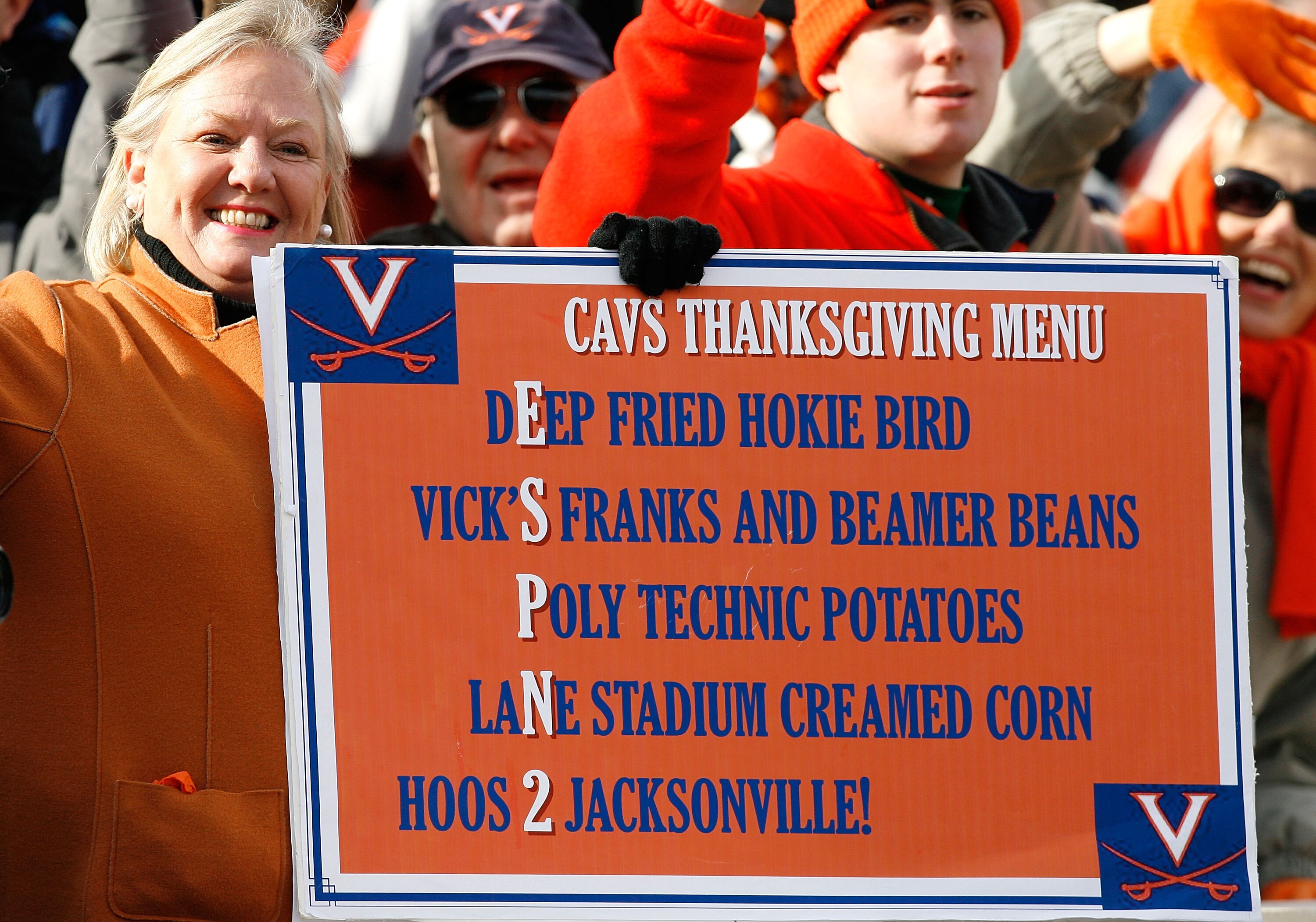 CHARLOTTESVILLE, VA - NOVEMBER 24:  A fan of the Virginia Cavaliers holds up her sign for a Cavs Thanksgiving menu during the first half against the Virginia Tech Hokies at Scott Stadium on November 24, 2007 in Charlottesville, Virginia.  Virginia Tech de
