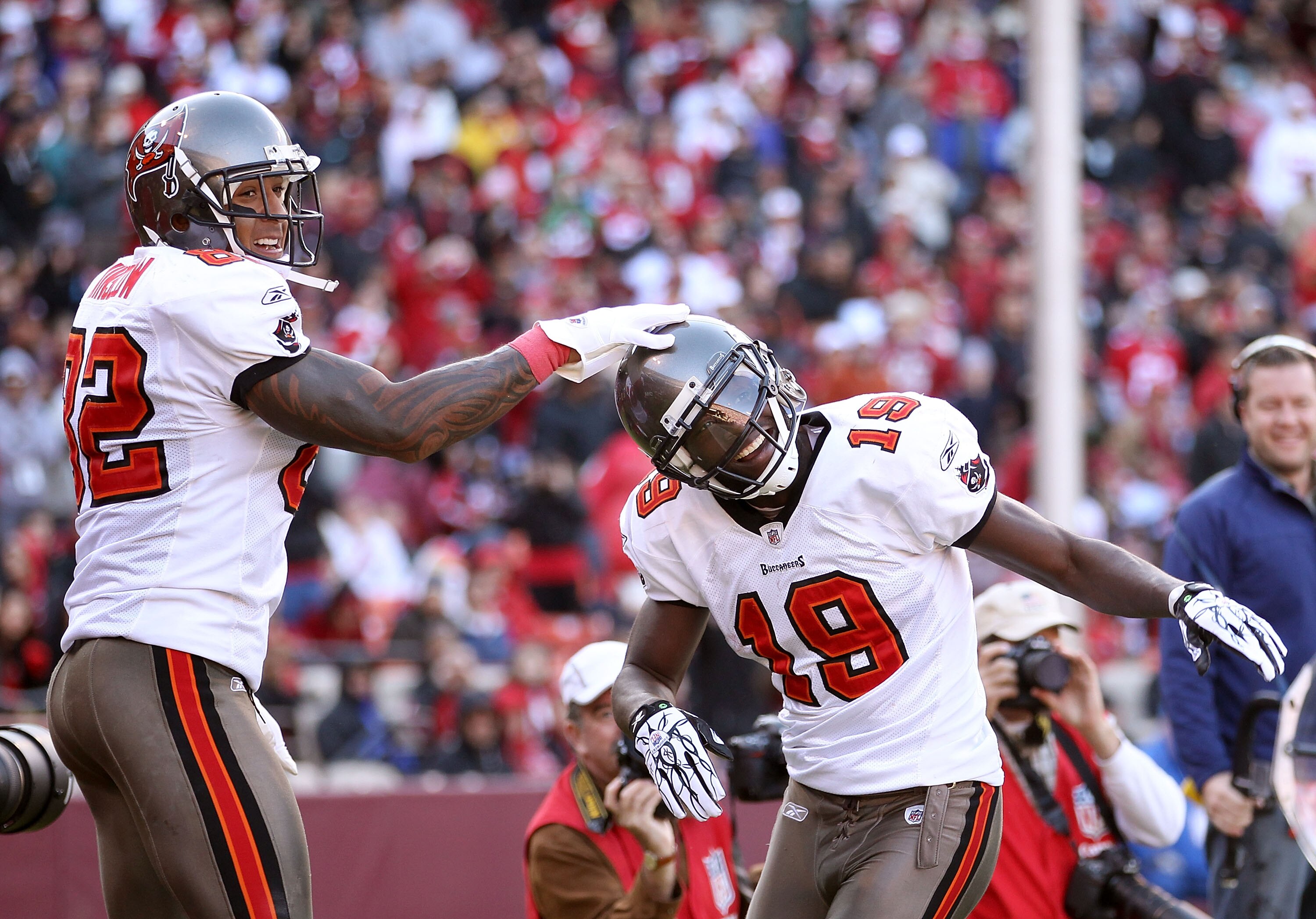SAN FRANCISCO - NOVEMBER 21:  Mike Williams #19 of the Tampa Bay Buccaneers is congratulated by Kellen Winslow #82 after he scored a touchdown against the San Francisco 49ers at Candlestick Park on November 21, 2010 in San Francisco, California.  (Photo b