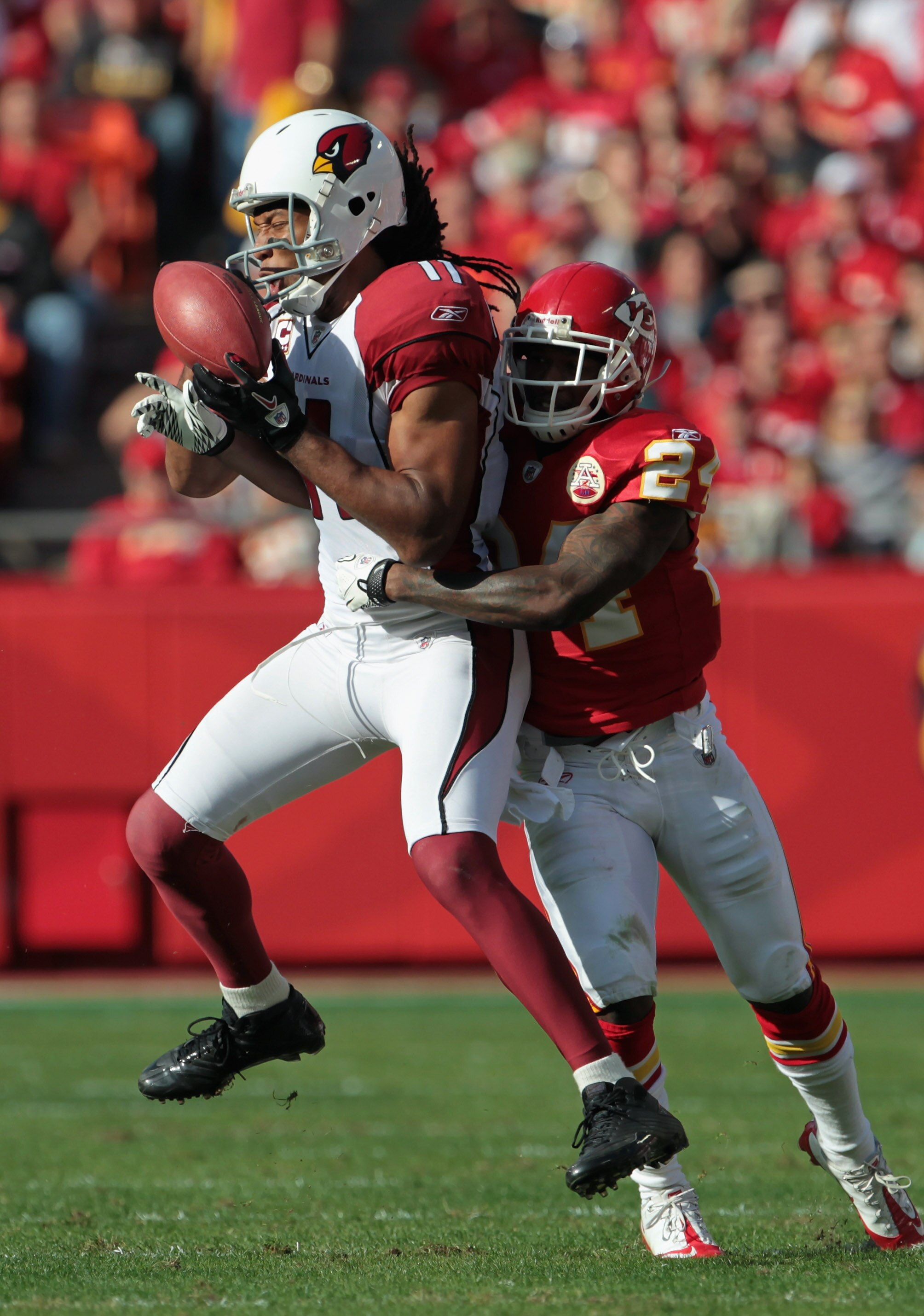 KANSAS CITY, MO - NOVEMBER 21:  Larry Fitzgerald #11 of the Arizona Cardinals makes a catch as Brandon Flowers #24 of the Kansas City Chiefs defends during the game on November 21, 2010 at Arrowhead Stadium in Kansas City, Missouri.  (Photo by Jamie Squir